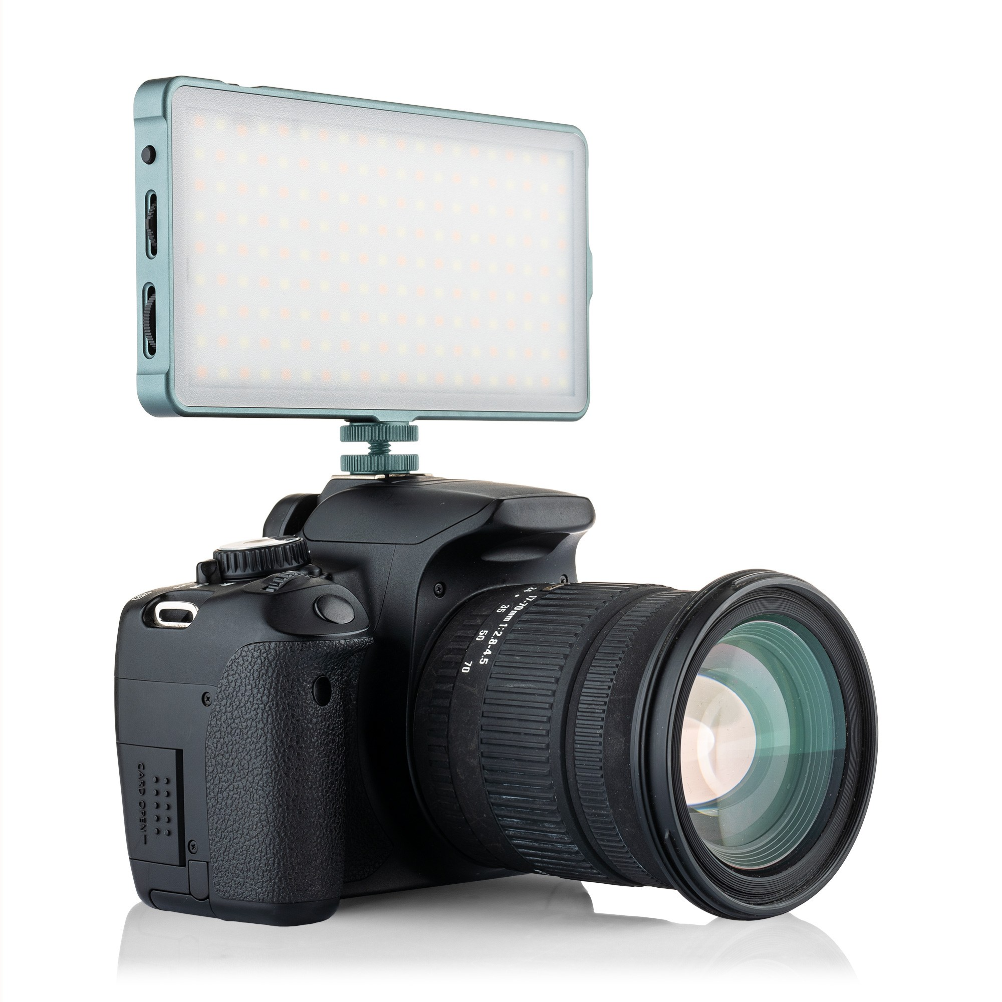 A black DSLR camera with a mounted LED panel on the hot shoe against a white background.