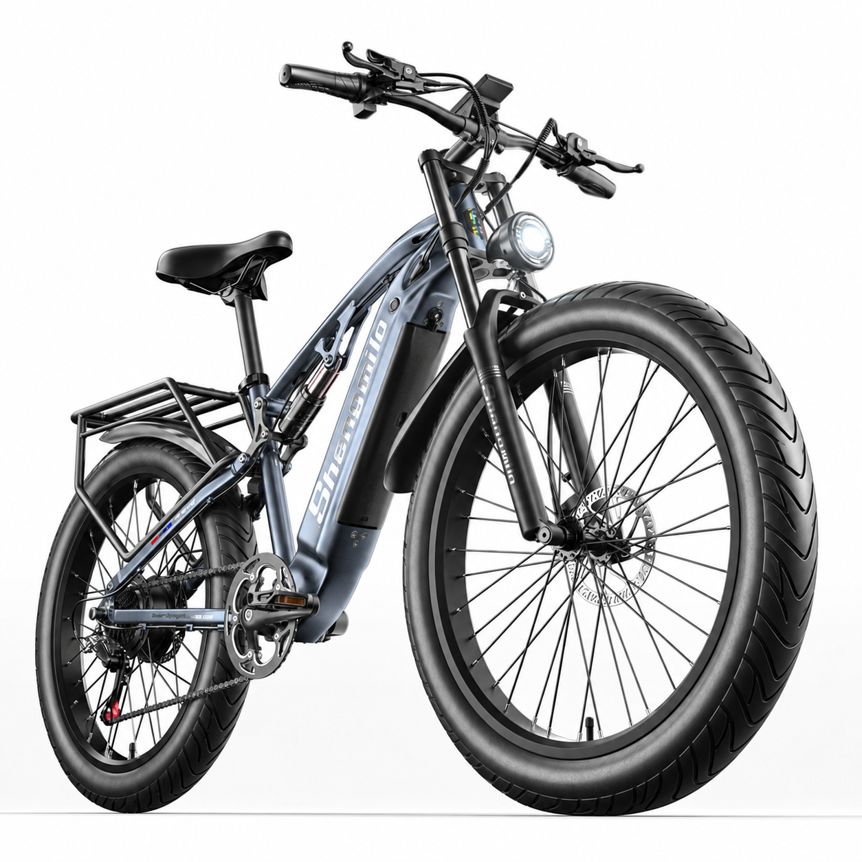 Nowoczesny szary rower elektryczny typu fatbike z grubymi oponami, przednim reflektorem i bagażnikiem.