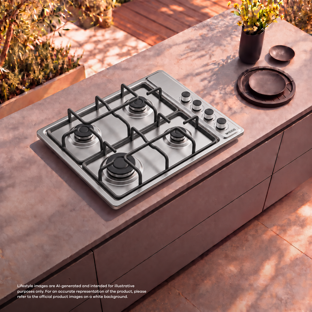 A silver gas cooktop on an outdoor stone counter next to a flower vase.