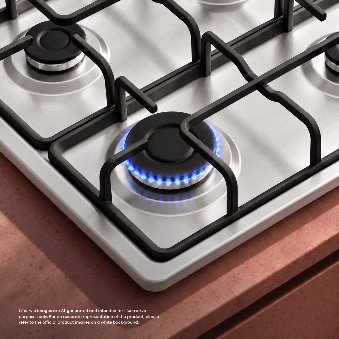 A silver gas cooktop with a black grate features a burning blue flame.