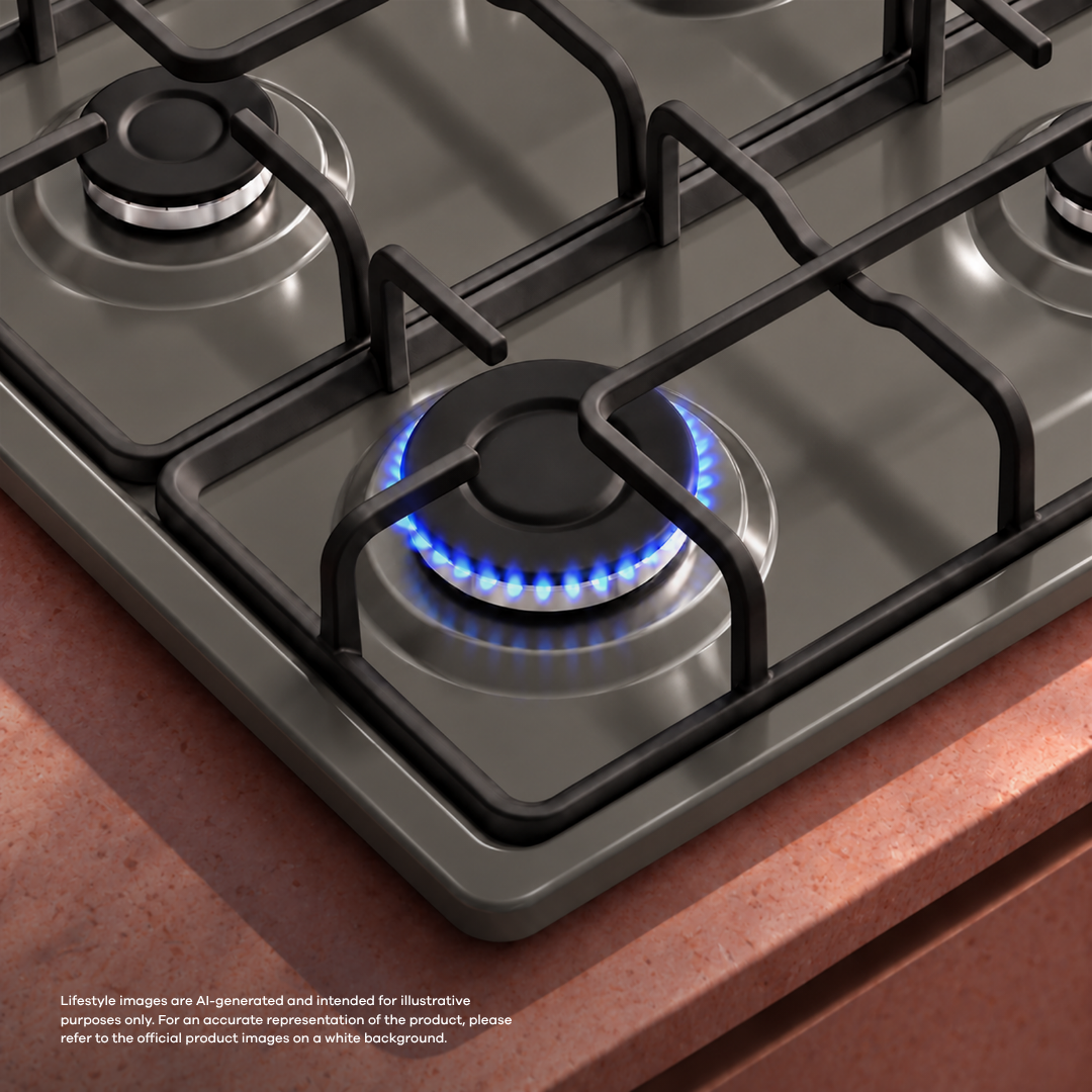 A gas cooktop featuring a burning blue flame on one burner and black grates.