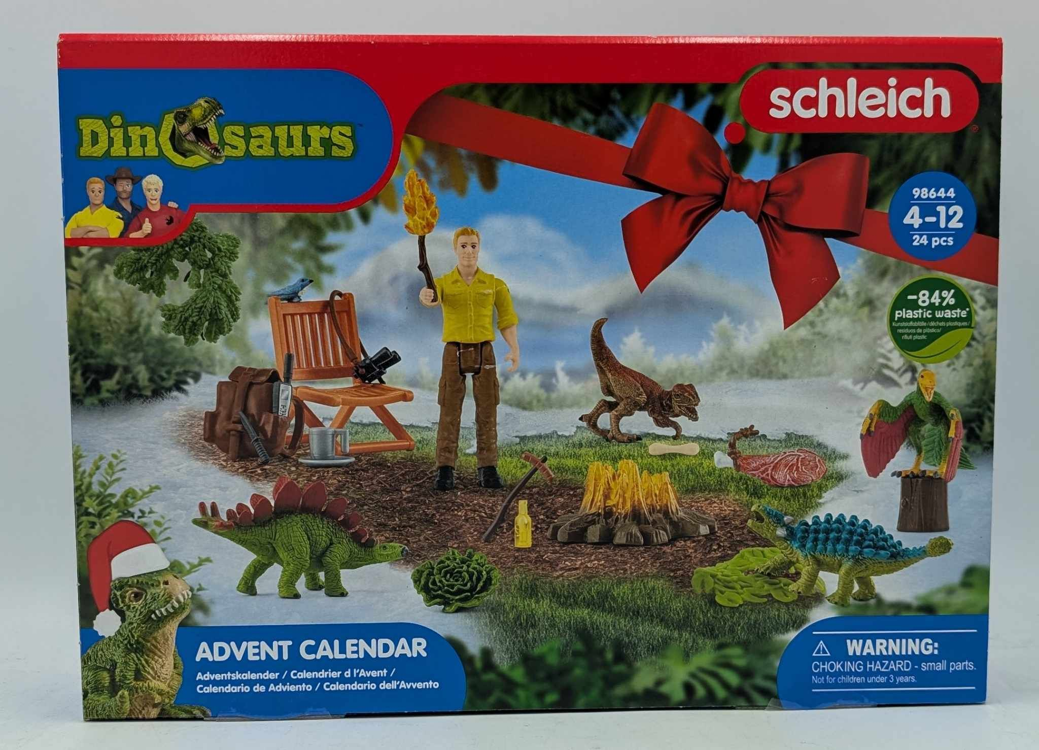 Schleich Dinosaurier Adventskalender mit Spielzeugfiguren, Mensch und Landschaftselementen.