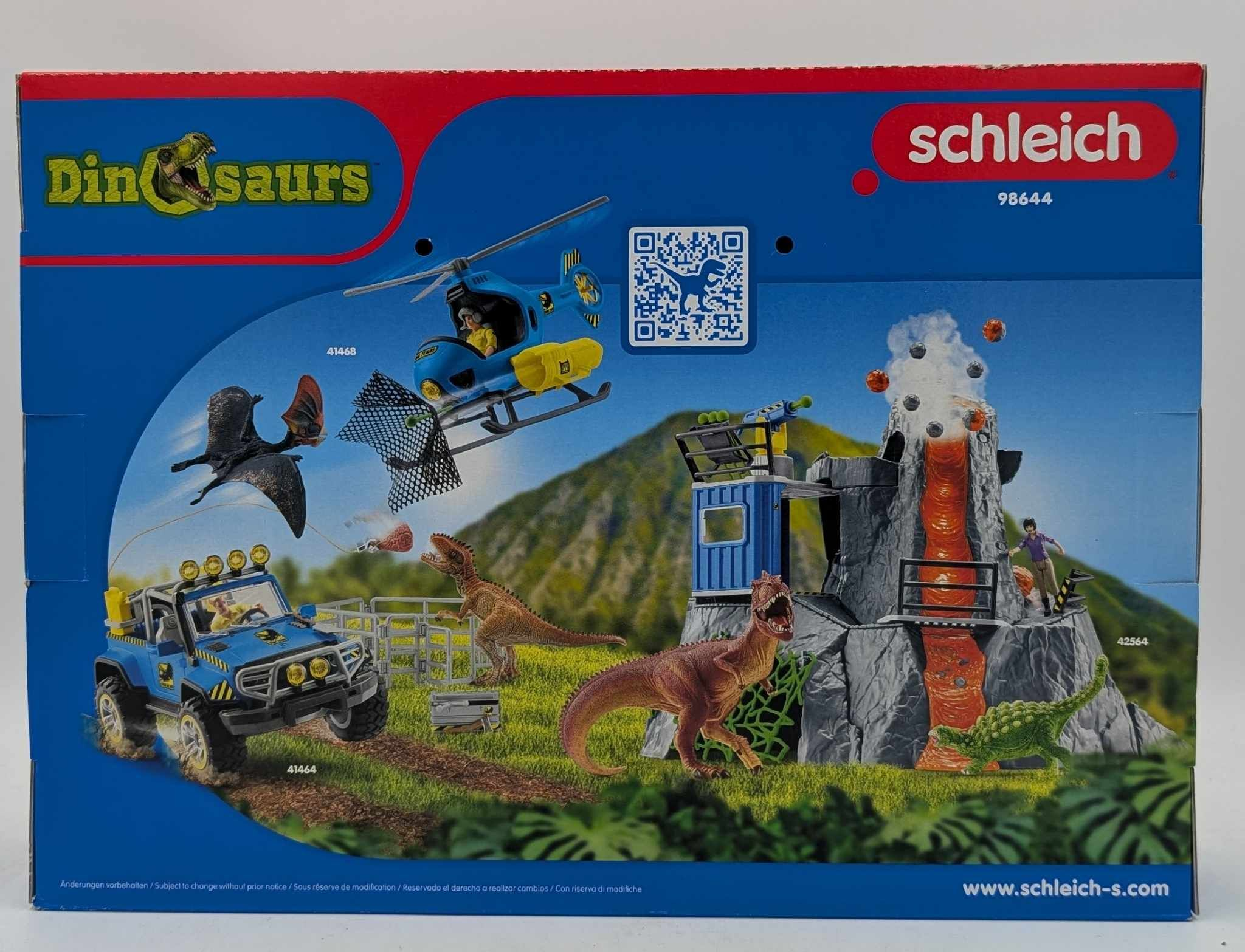 Schleich Dinosaurs Spielzeugset Box mit Vulkan, Dinosauriern, einem blauen Jeep, Hubschrauber und Figuren.