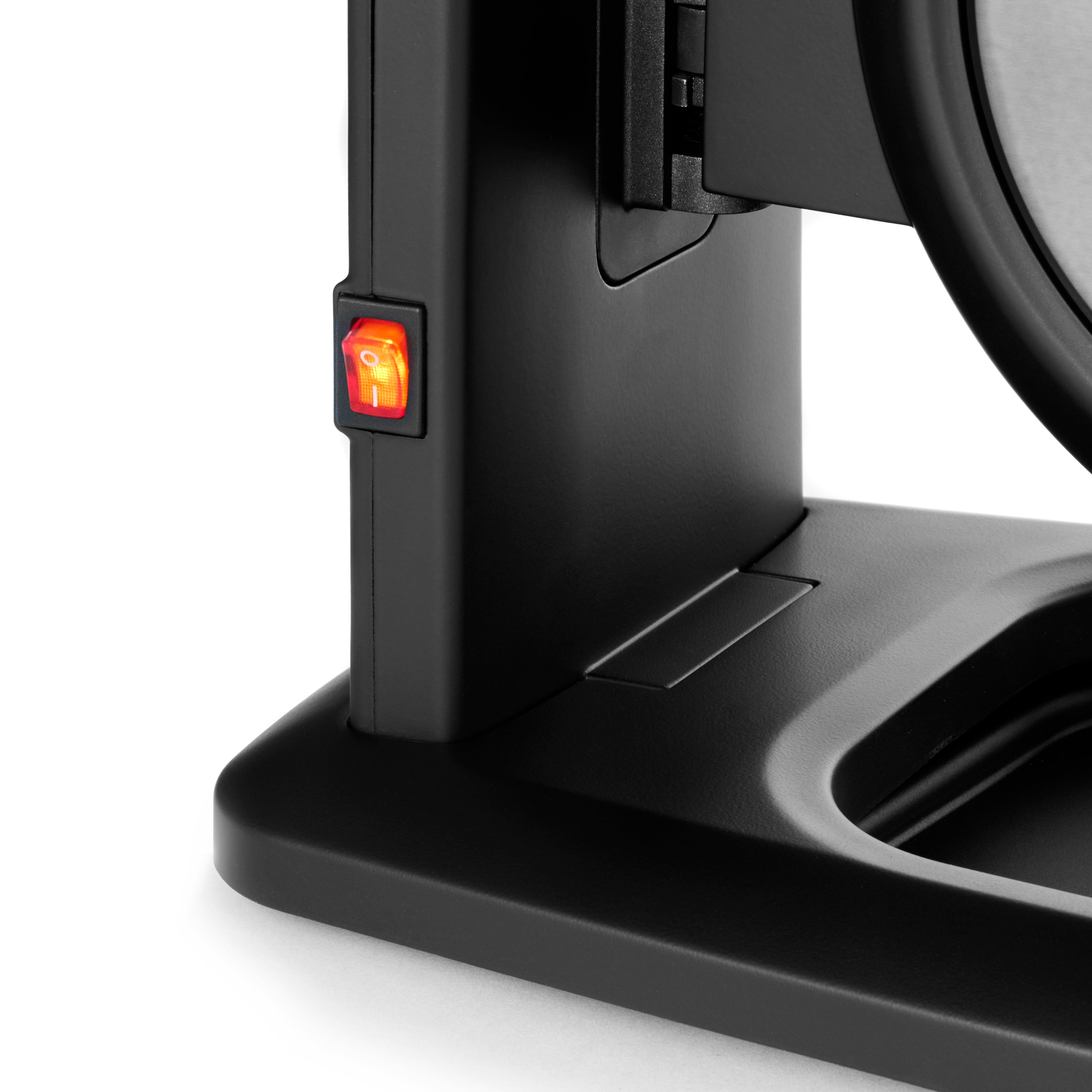 A close-up of a black appliance stand with an illuminated red power switch on its side.