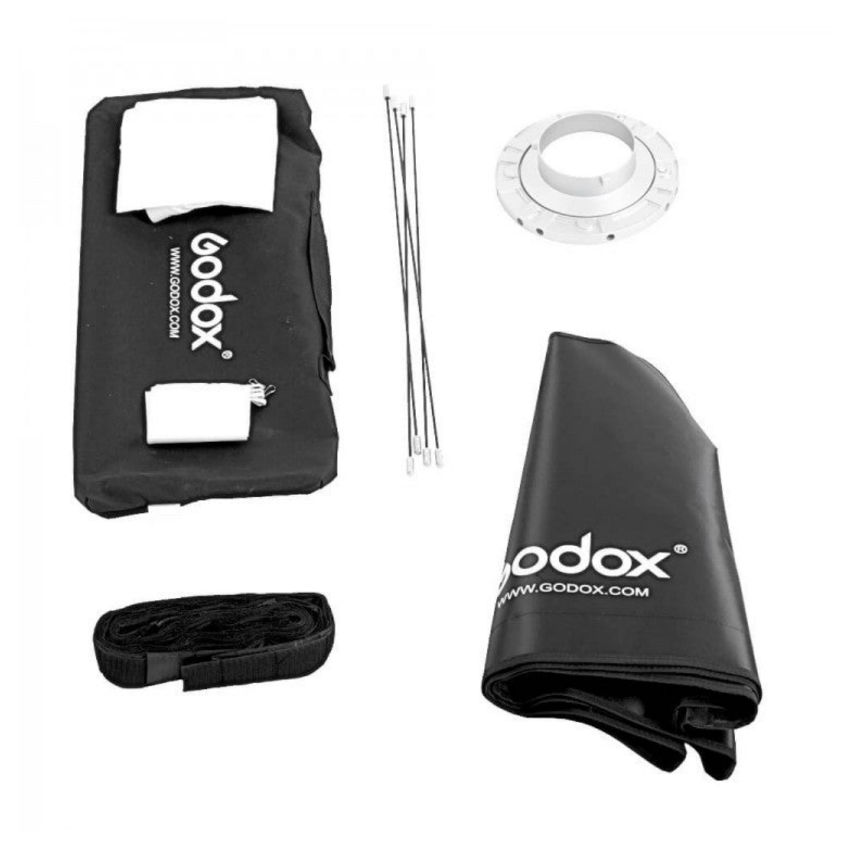 Pezzi del kit softbox Godox disposti in piano con custodia, diffusore, aste, anello e tessuto.
