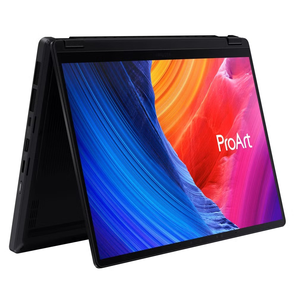 Czarny laptop ProArt w trybie namiotu wyświetla kolorową tapetę z kanionem.