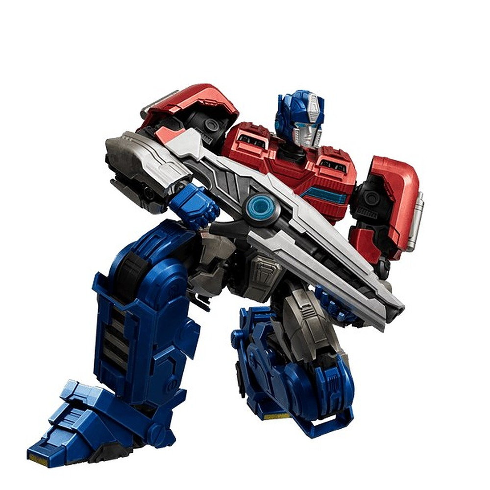 Czerwono-niebiesko-srebrna figurka akcji Transformers klęczy na ziemi, trzymając duży karabin.