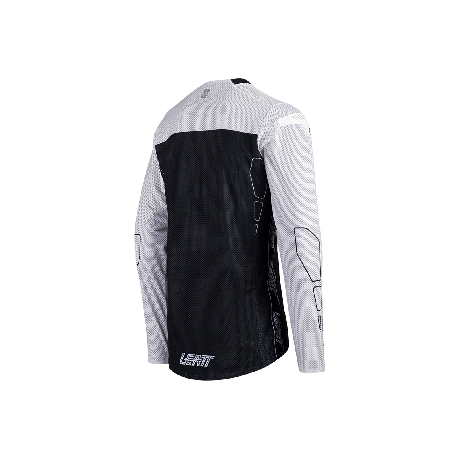 Rückansicht eines weiß-schwarzen Leatt-Motocross-Jerseys mit Mesh-Gewebe und langen Ärmeln vor weißem Hintergrund.