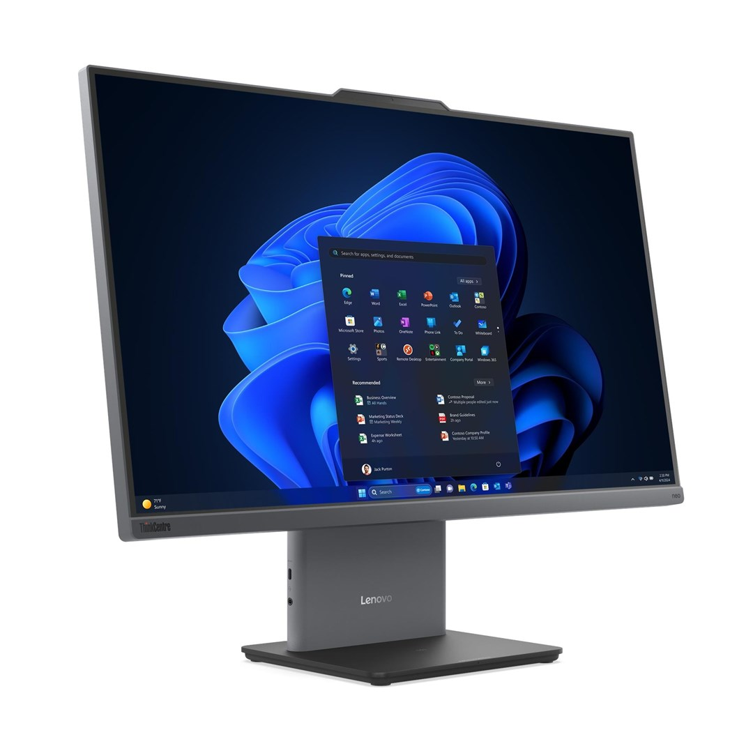 Szary komputer All-in-One Lenovo wyświetla menu Start systemu Windows 11 na niebieskim tle.
