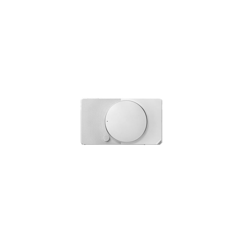 Un dispositivo elettronico bianco e minimalista con un'ampia manopola tonda e superficie testurizzata.