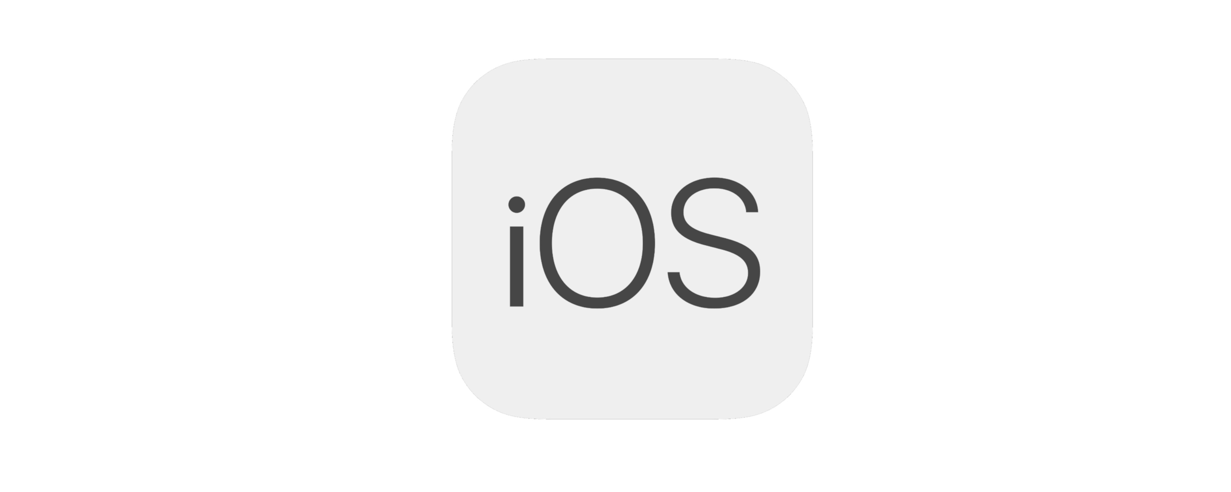 Szare logo iOS w bezszeryfowej czcionce na jasnoszarym tle.
