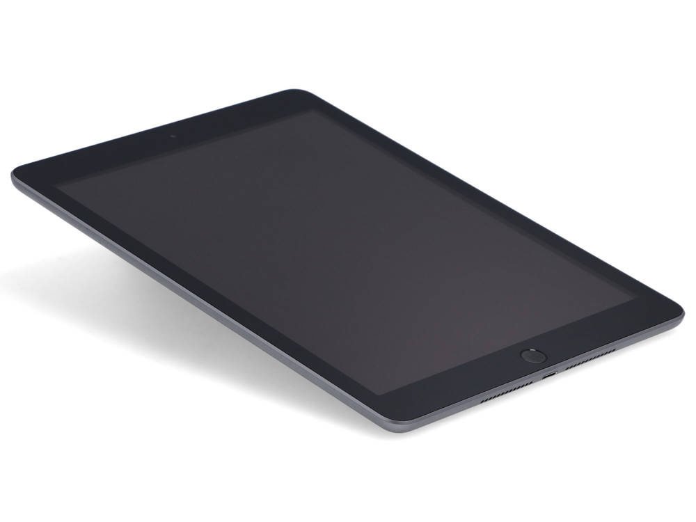 Czarny tablet spoczywa ukośnie na białej powierzchni z wyłączonym ekranem.