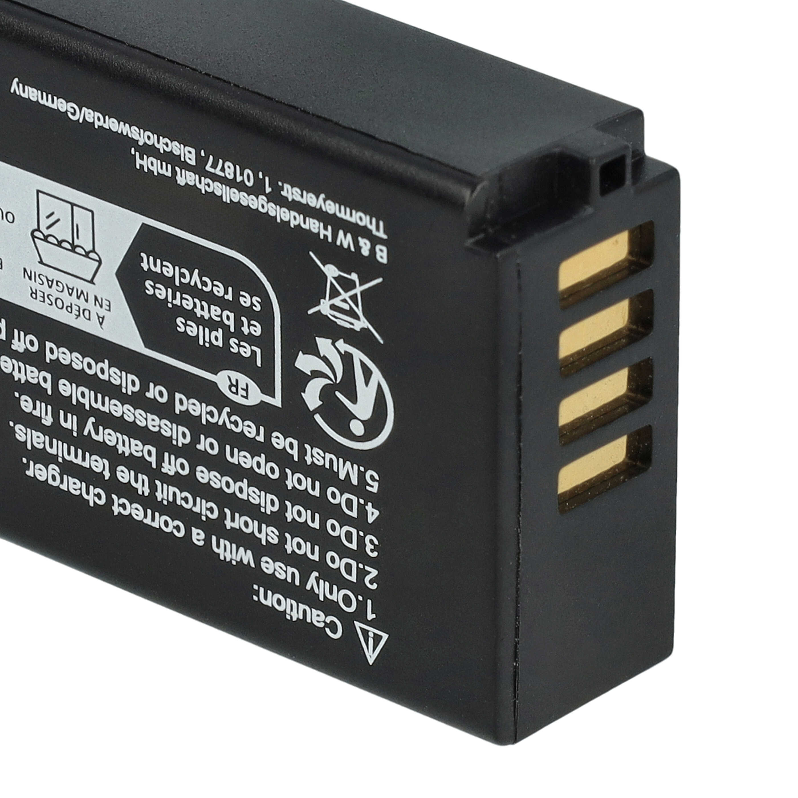 Schwarze Batterie mit goldenen Anschlüssen und weißen Warnhinweisen.