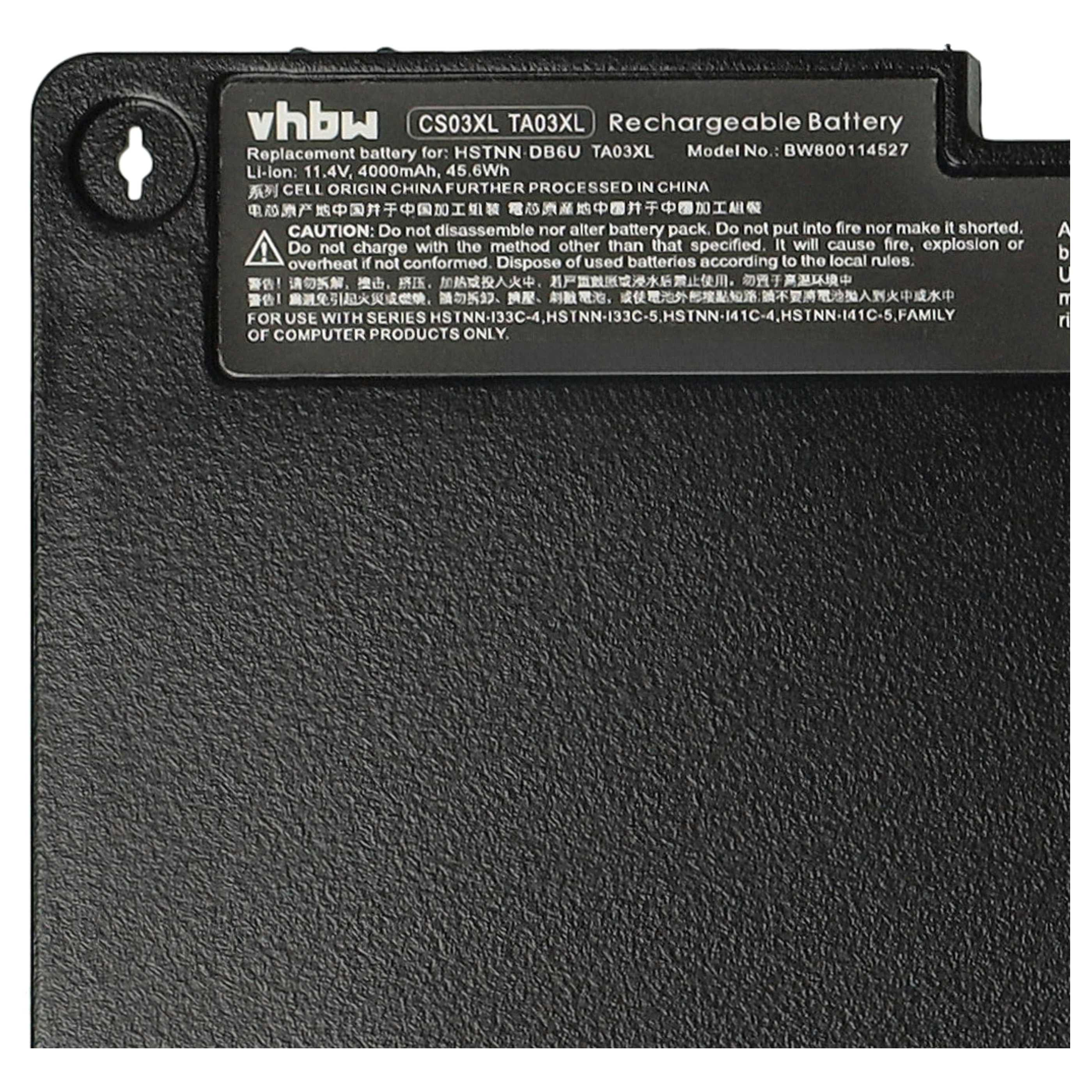 Nahaufnahme einer schwarzen Laptop-Batterie mit weißer Aufschrift und Sicherheitshinweisen.