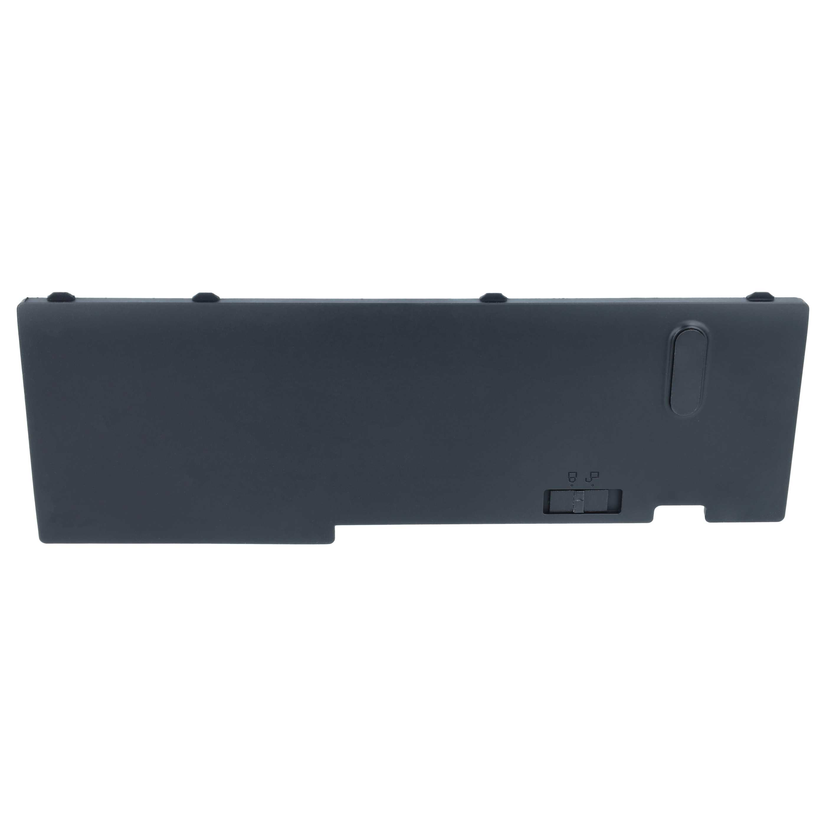 Eine schwarze, rechteckige Laptop-Batterieabdeckung mit Entriegelungsschalter.