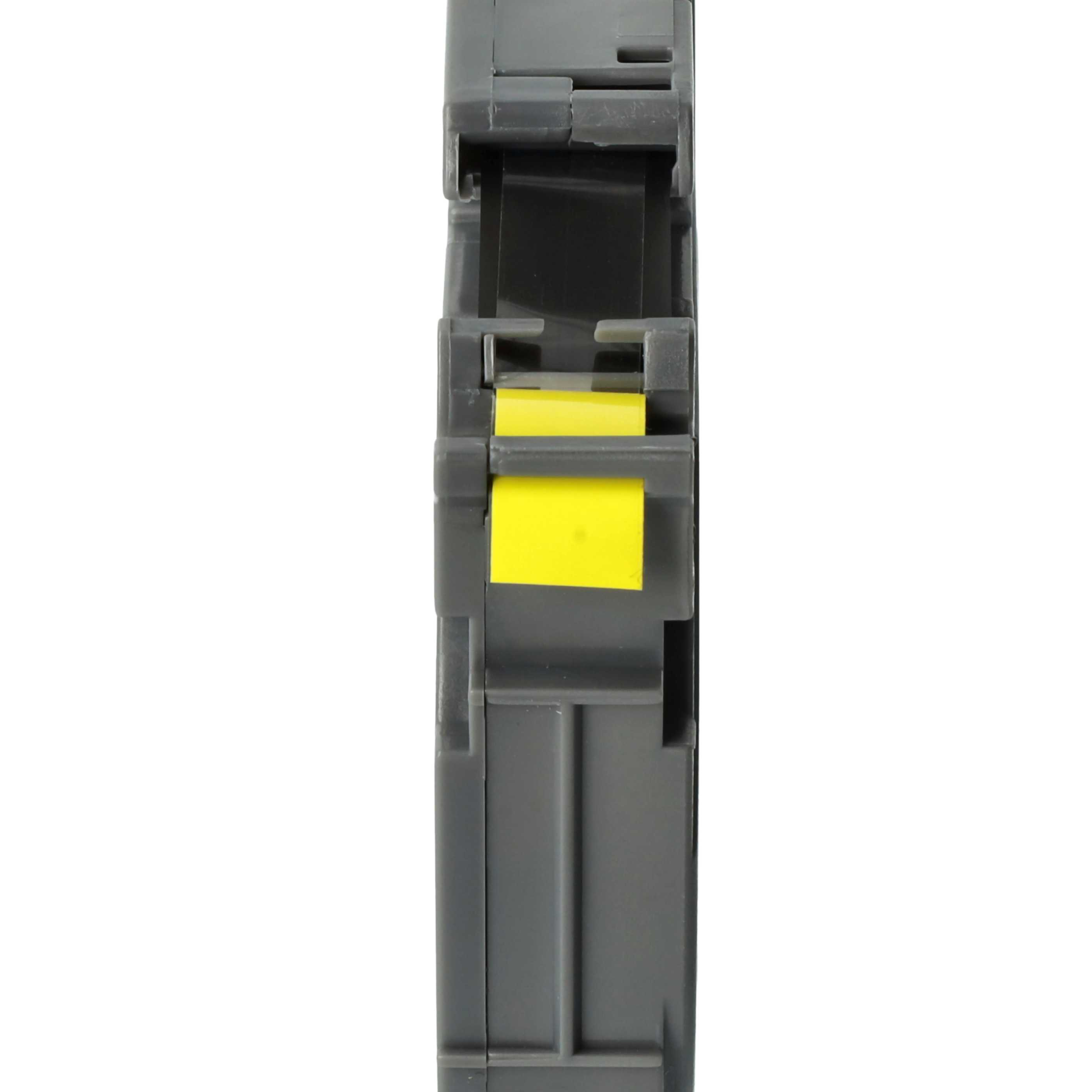 Graue Kunststoffkassette mit einer gelben Bandrolle im Inneren, weißer Hintergrund.