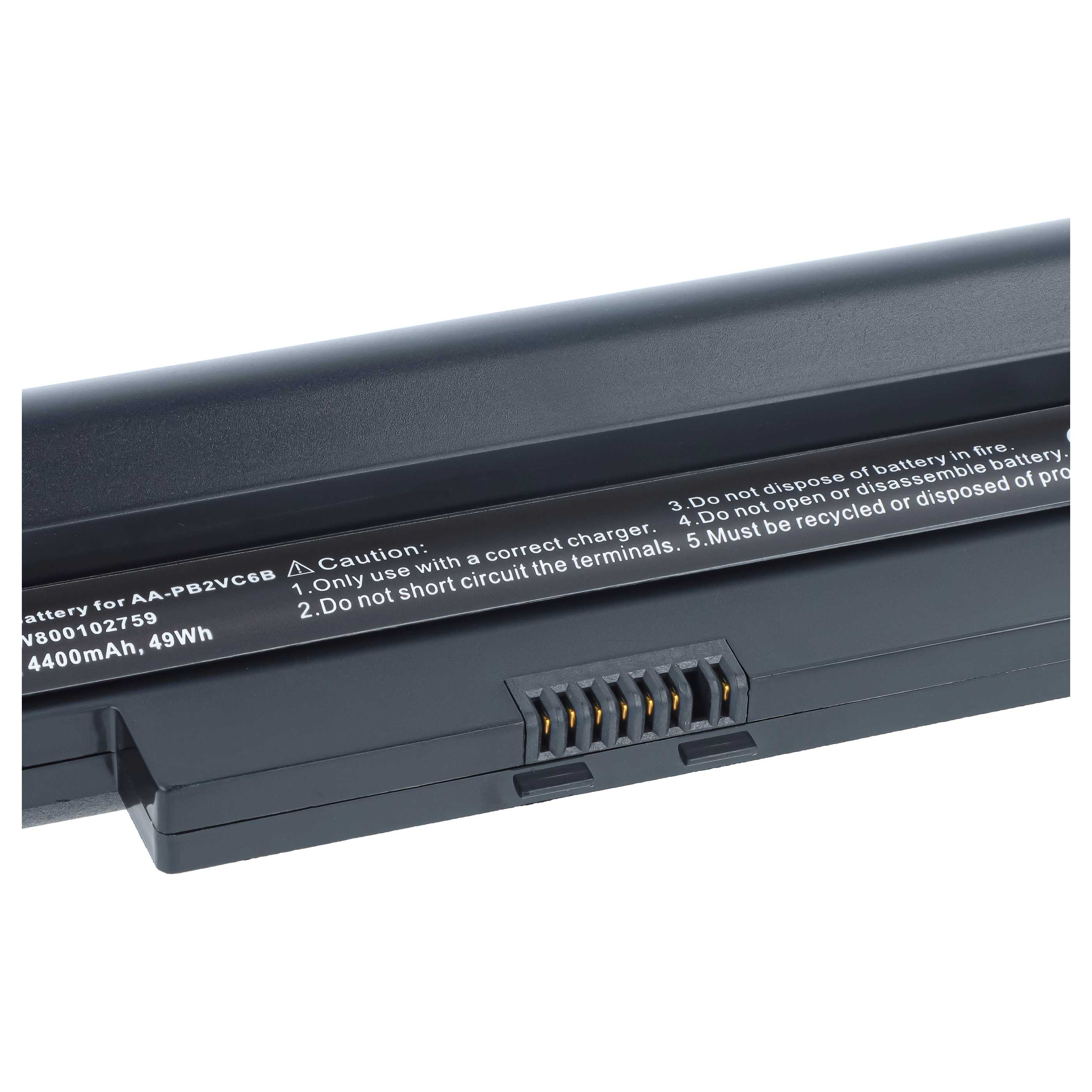 Nahaufnahme einer schwarzen Laptop-Batterie mit Warnhinweisen und goldenen Kontakten.