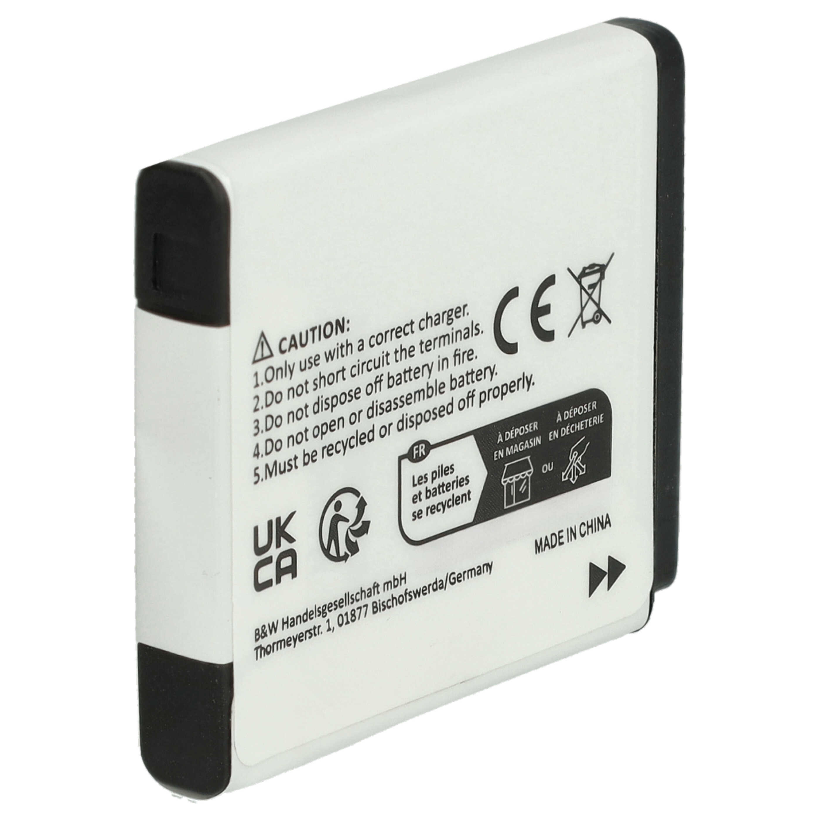 Eine rechteckige weiße Kamera-Ersatzbatterie mit schwarzen Endkappen und gedruckten Warnhinweisen auf der Seite.