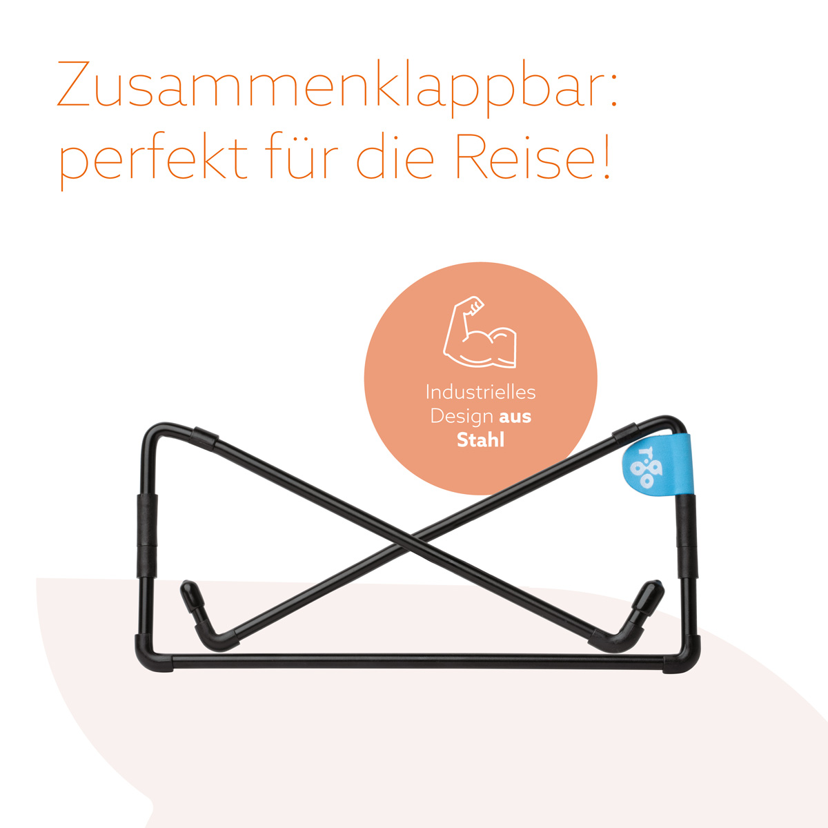 A foldable black steel laptop stand with German text about travel and industrial design.