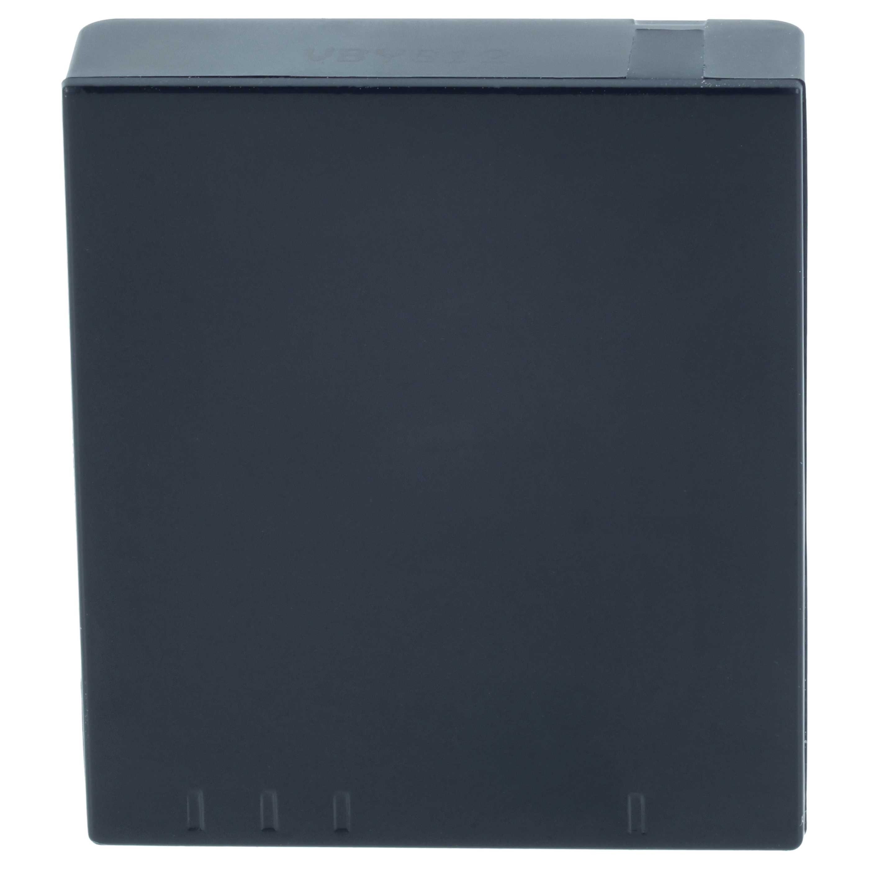 Eine schwarze, quadratische Box mit kleinen Öffnungen an der Unterseite.