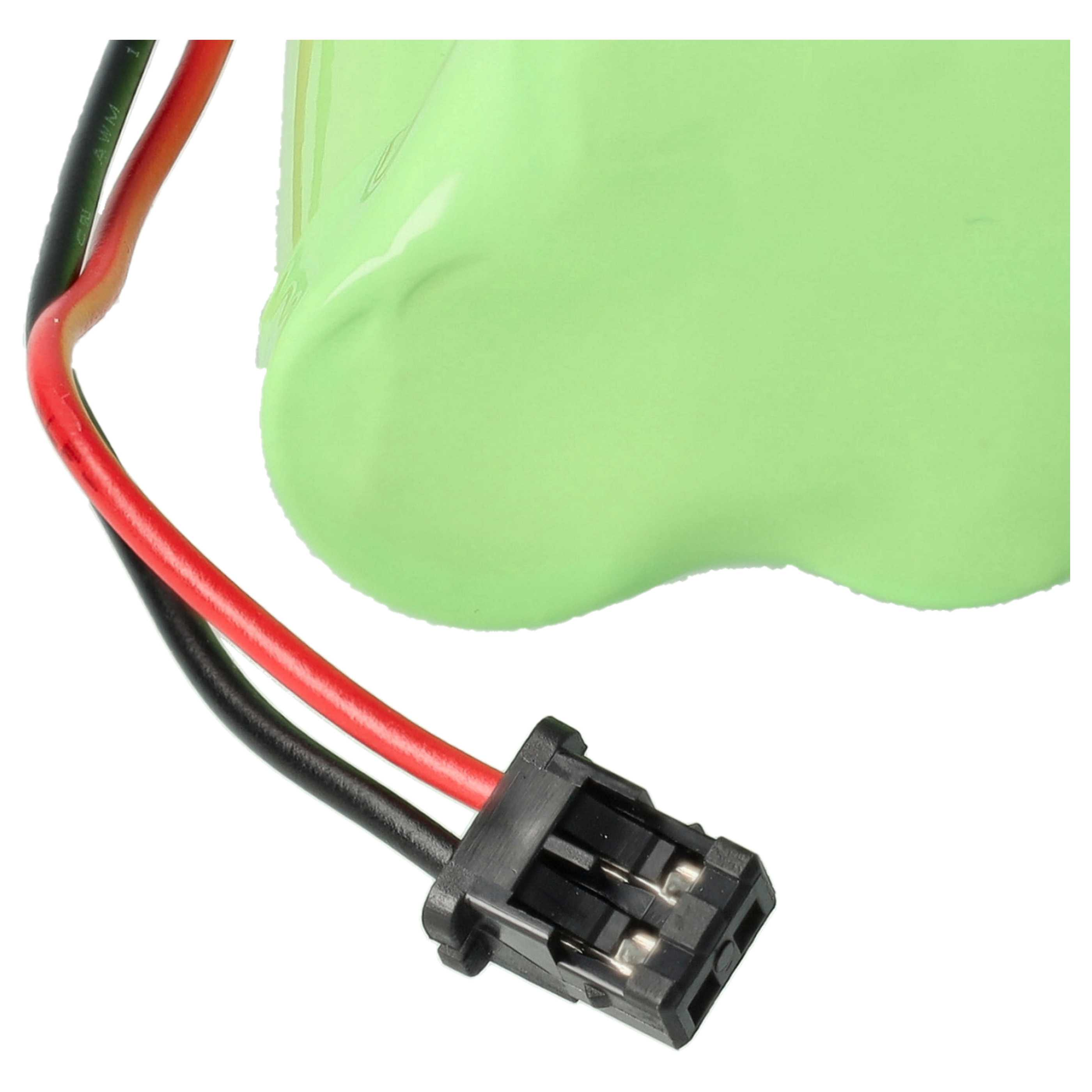 Nahaufnahme einer grünen Batterie mit einem roten und einem schwarzen Kabel, die in einem kleinen schwarzen Steckverbinder enden.