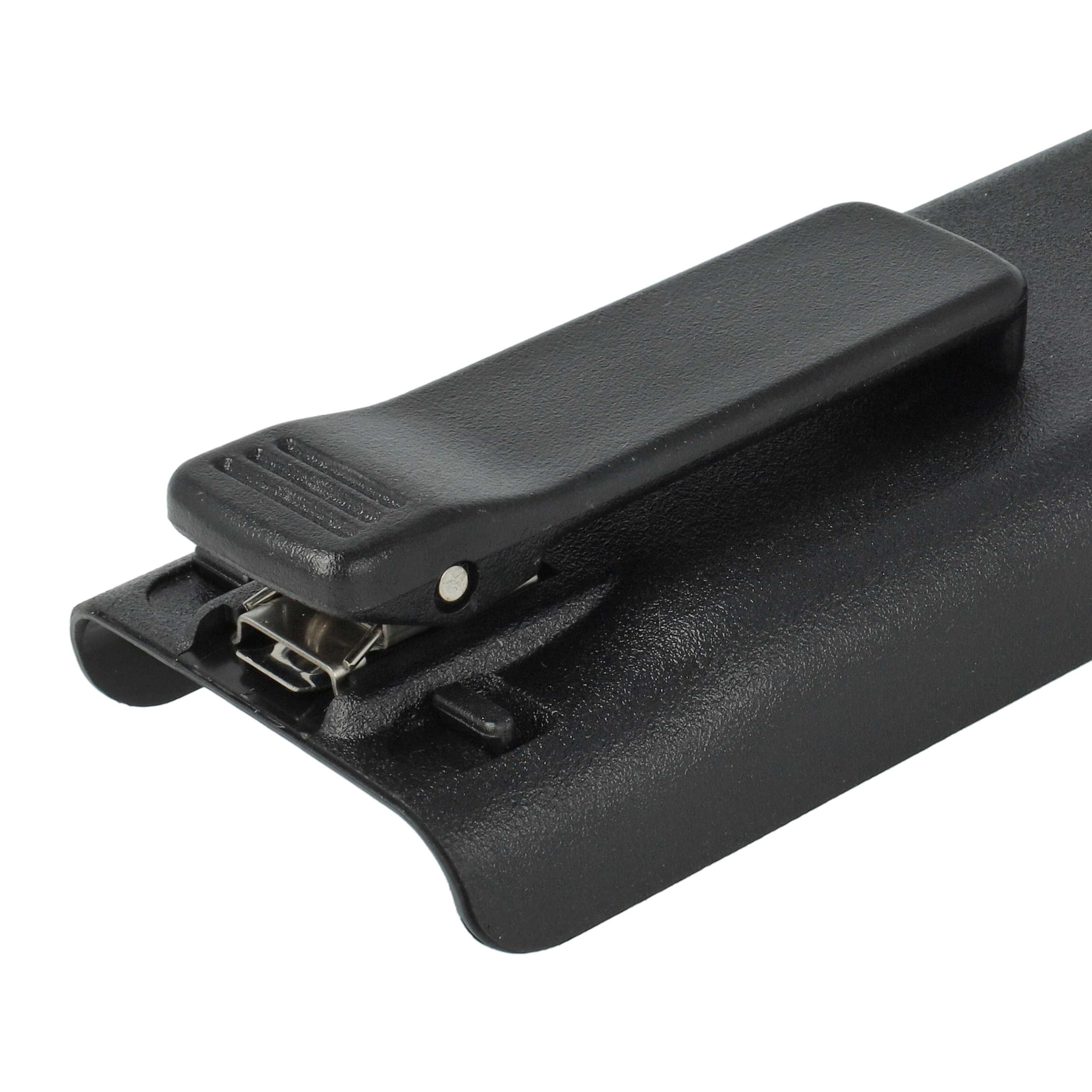 Ein schwarzer Holsterclip aus Kunststoff mit einer kleinen silbernen Niete auf einer strukturierten Oberfläche.