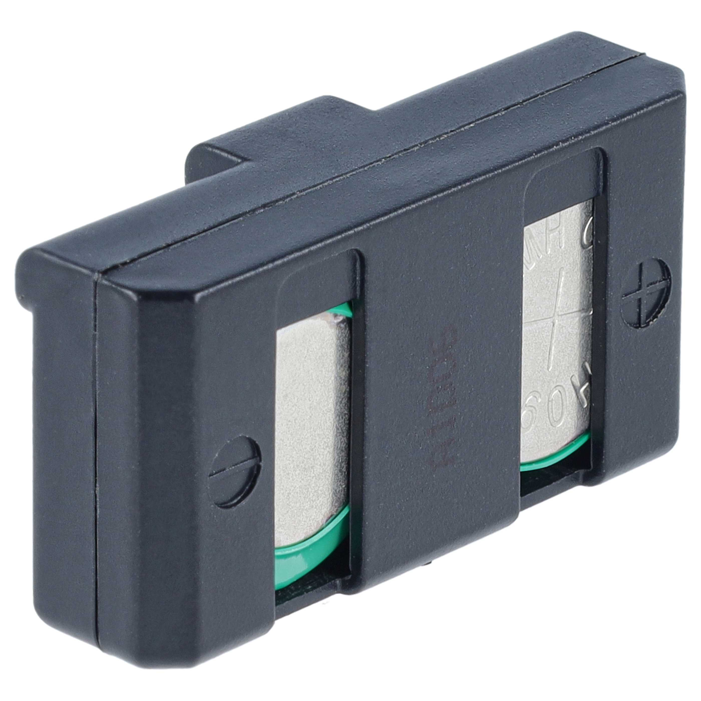 Ein schwarzes Kunststoffgehäuse mit zwei silbernen Knopfzellenbatterien und grünen Dichtungen.