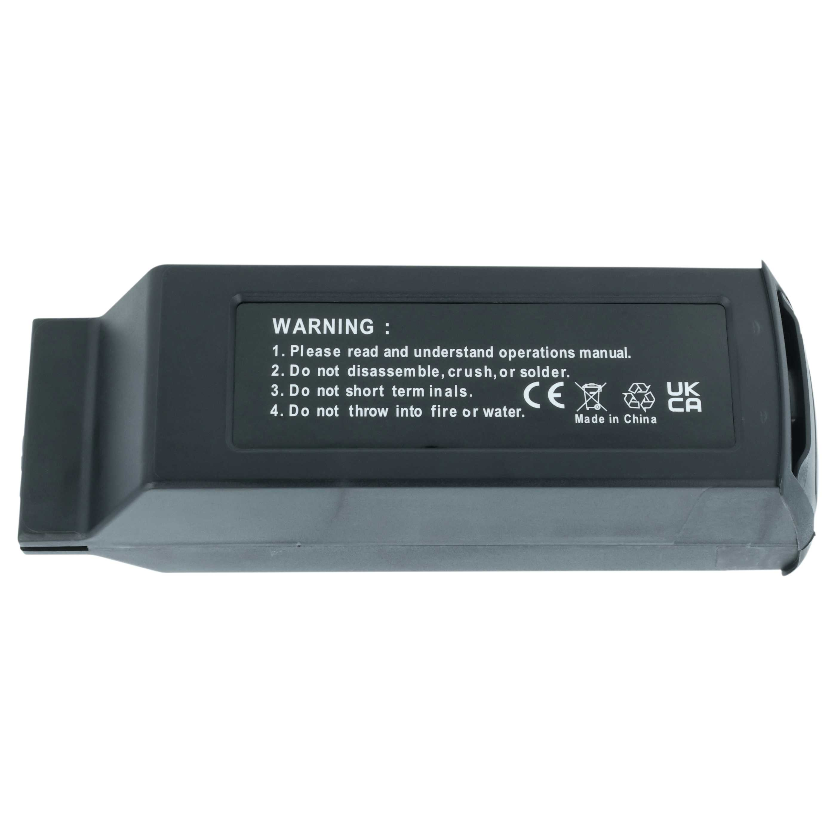 Eine schwarze Drohnenbatterie mit Warntext und Sicherheitssymbolen an der Seite.