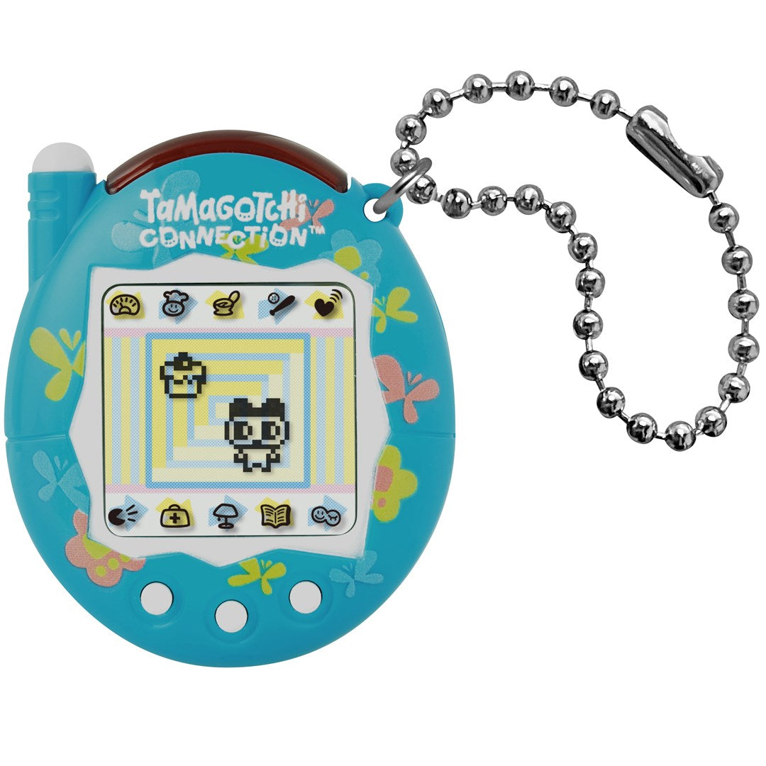 Niebieski Tamagotchi Connection z motywem motyli i kwiatów, grafiką ekranową i łańcuszkiem.