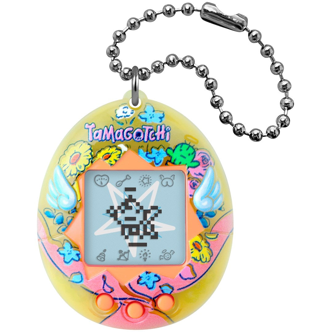 Żółte Tamagotchi z kwiatami, skrzydłami anioła i łańcuszkiem.