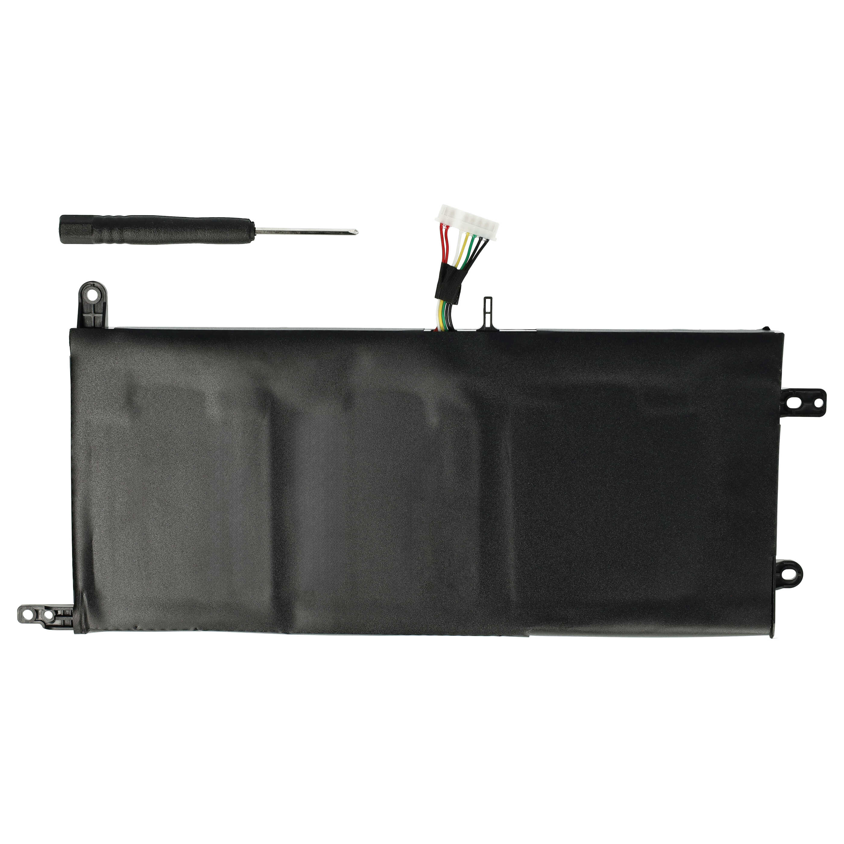 Ein schwarzer Laptop-Akku mit einem kleinen Schraubenzieher auf weißem Hintergrund.