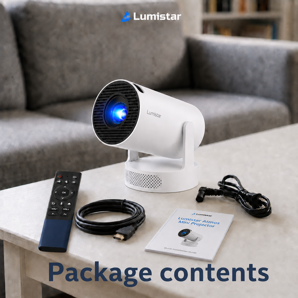 Ein weißer Lumistar Mini-Projektor mit Fernbedienung, Kabeln und Anleitung auf einem Tisch.