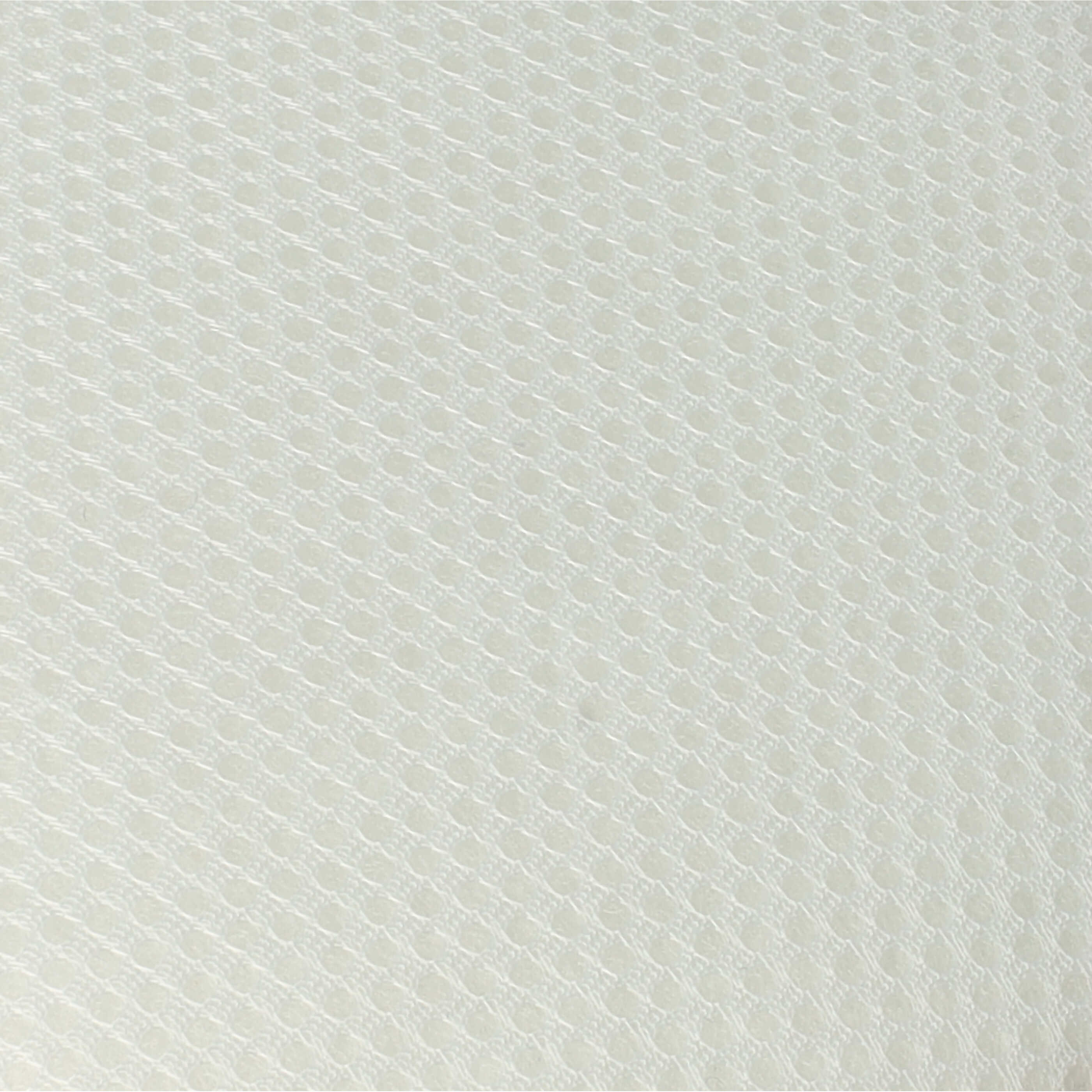 Nahaufnahme einer hellen Textur mit feinem, gleichmäßigem Punktmuster.