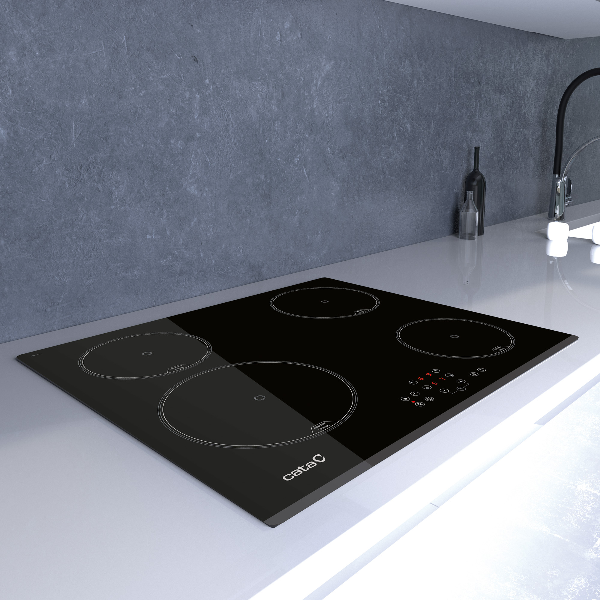 Placa de inducción negra con cuatro zonas de cocción en una encimera blanca en una cocina moderna.