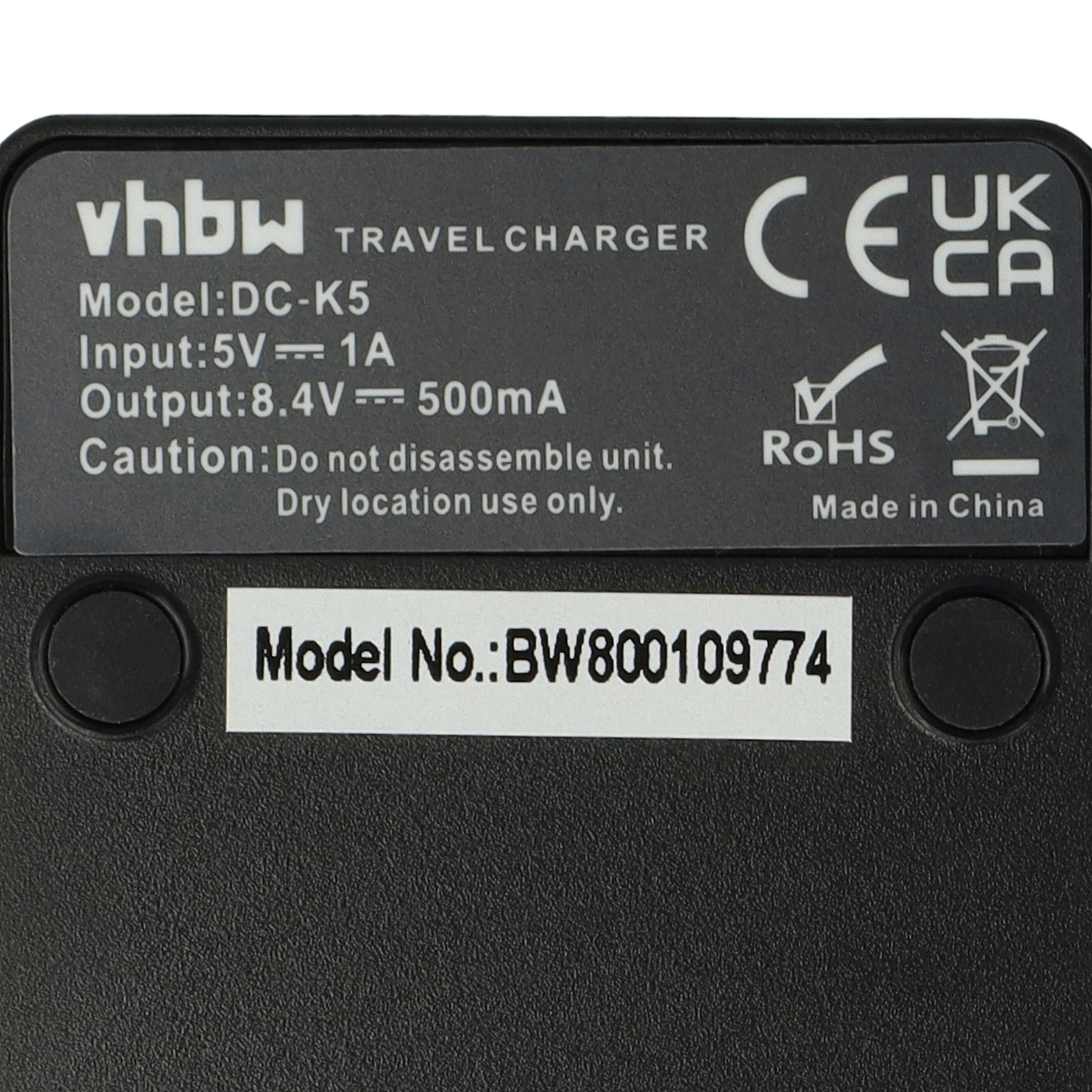 Etikett auf einem schwarzen vhbw Reise-Ladegerät mit technischen Daten, Modell DC-K5 und CE-Zeichen.