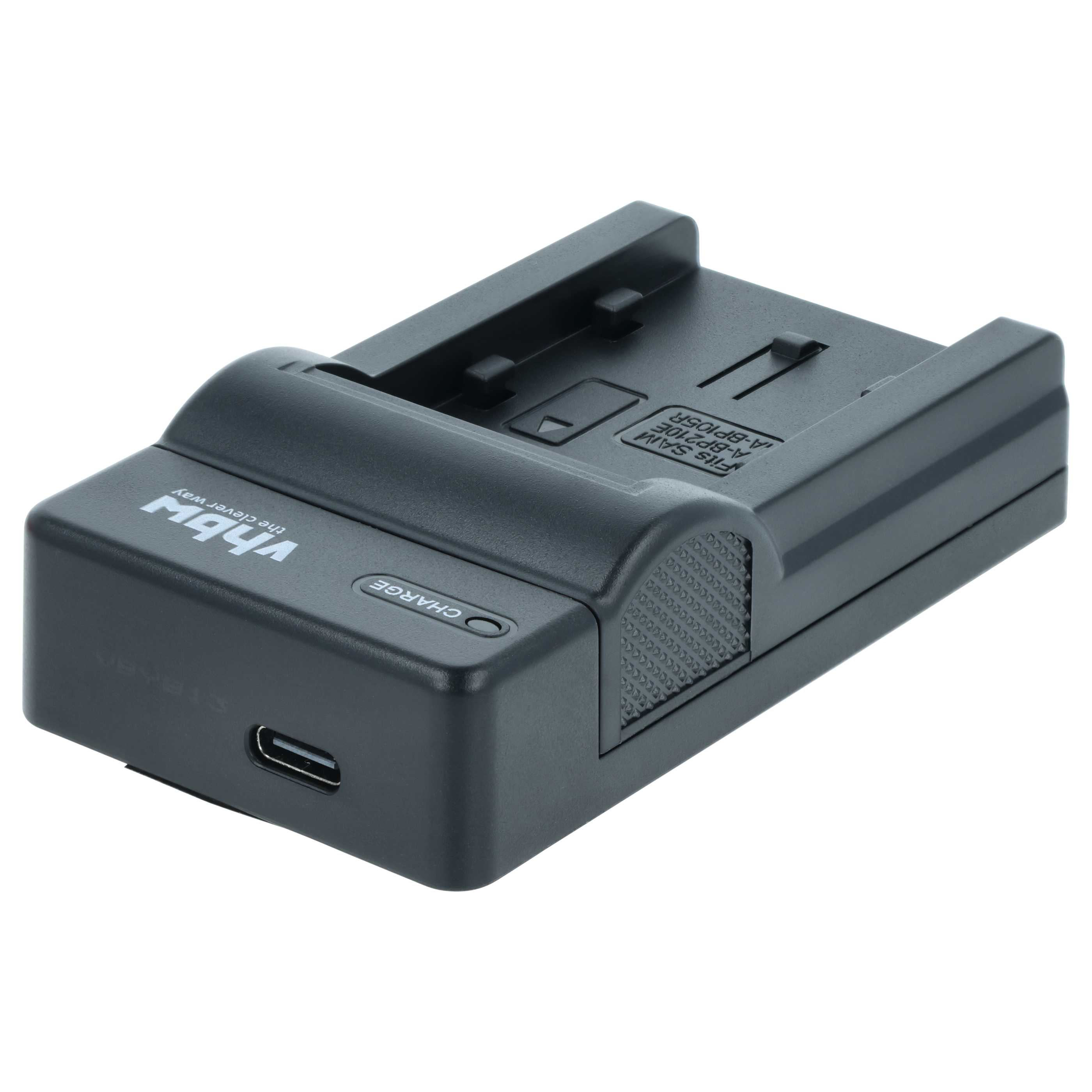 Ein schwarzes vhbw Akkuladegerät mit USB-C-Anschluss, Ladekontrollleuchte und strukturierten Seitenteilen auf weißem Grund.