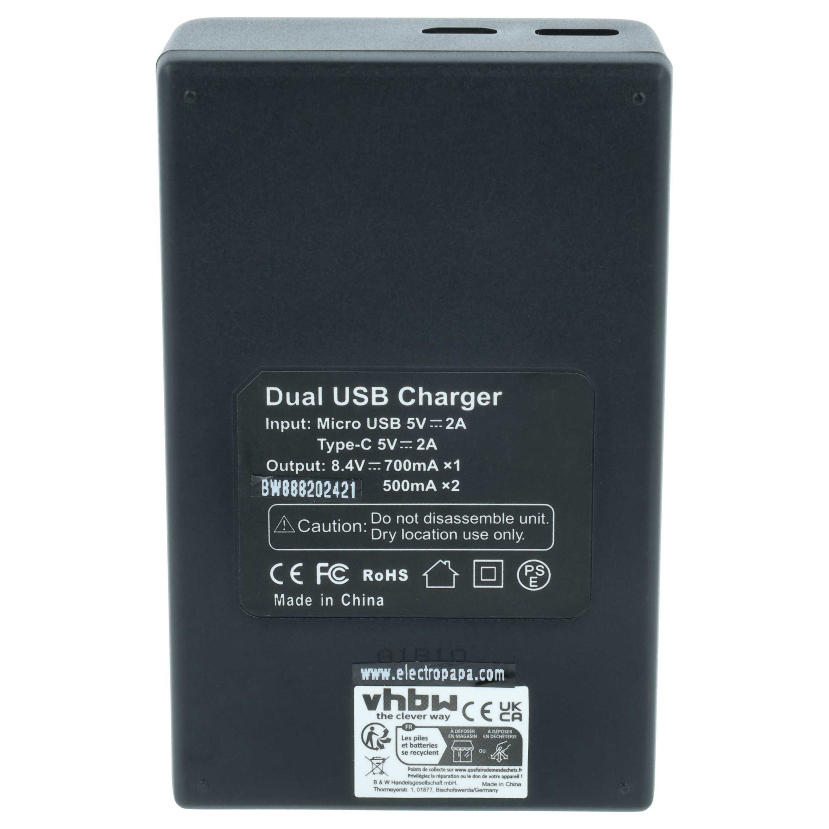 Schwarzes Dual-USB-Ladegerät mit technischen Daten, Warnhinweisen und Zertifizierungssymbolen auf der Vorderseite.