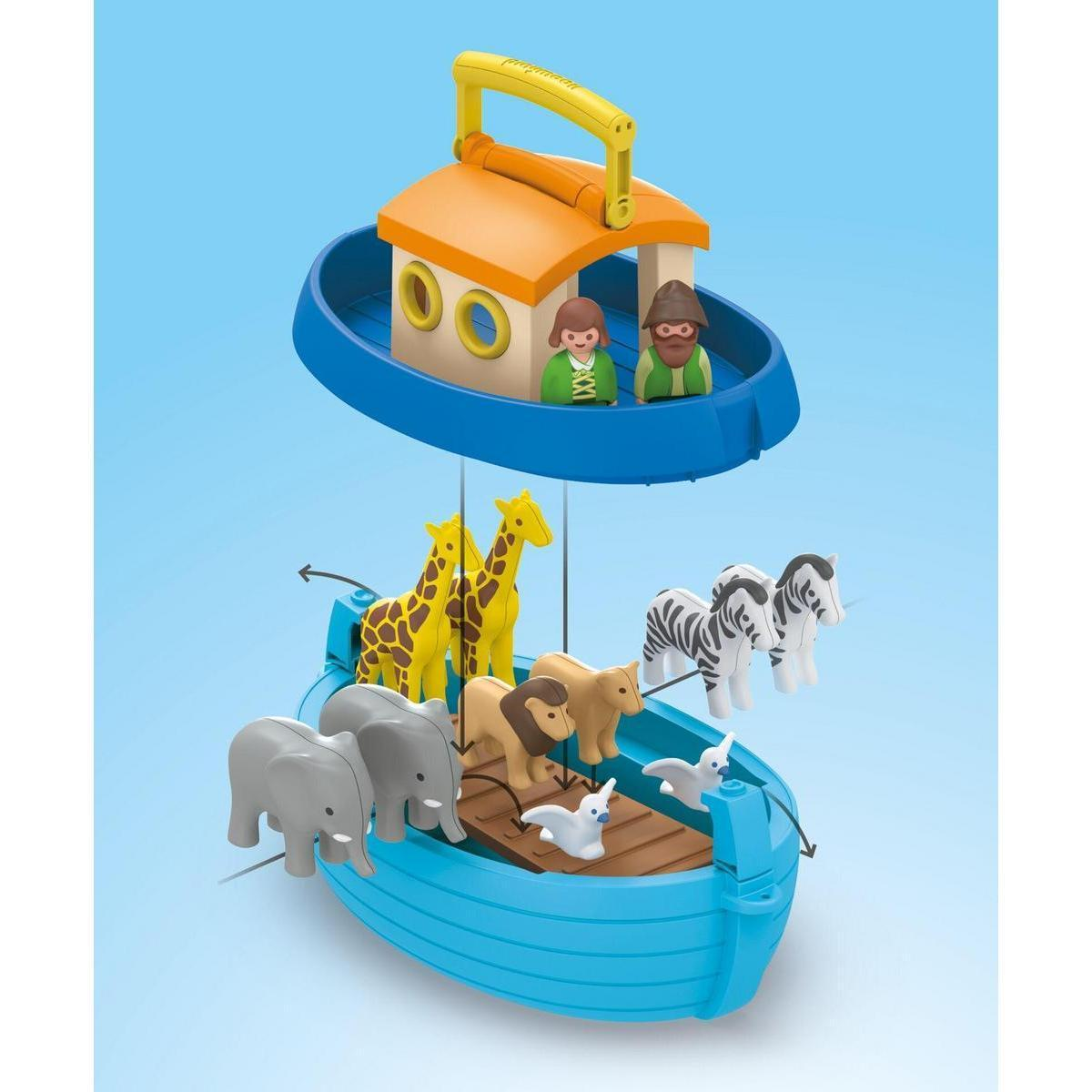 A toy Noah's Ark set featuring blue boats, figures, and various animals like giraffes, zebras, elephants, and lions.