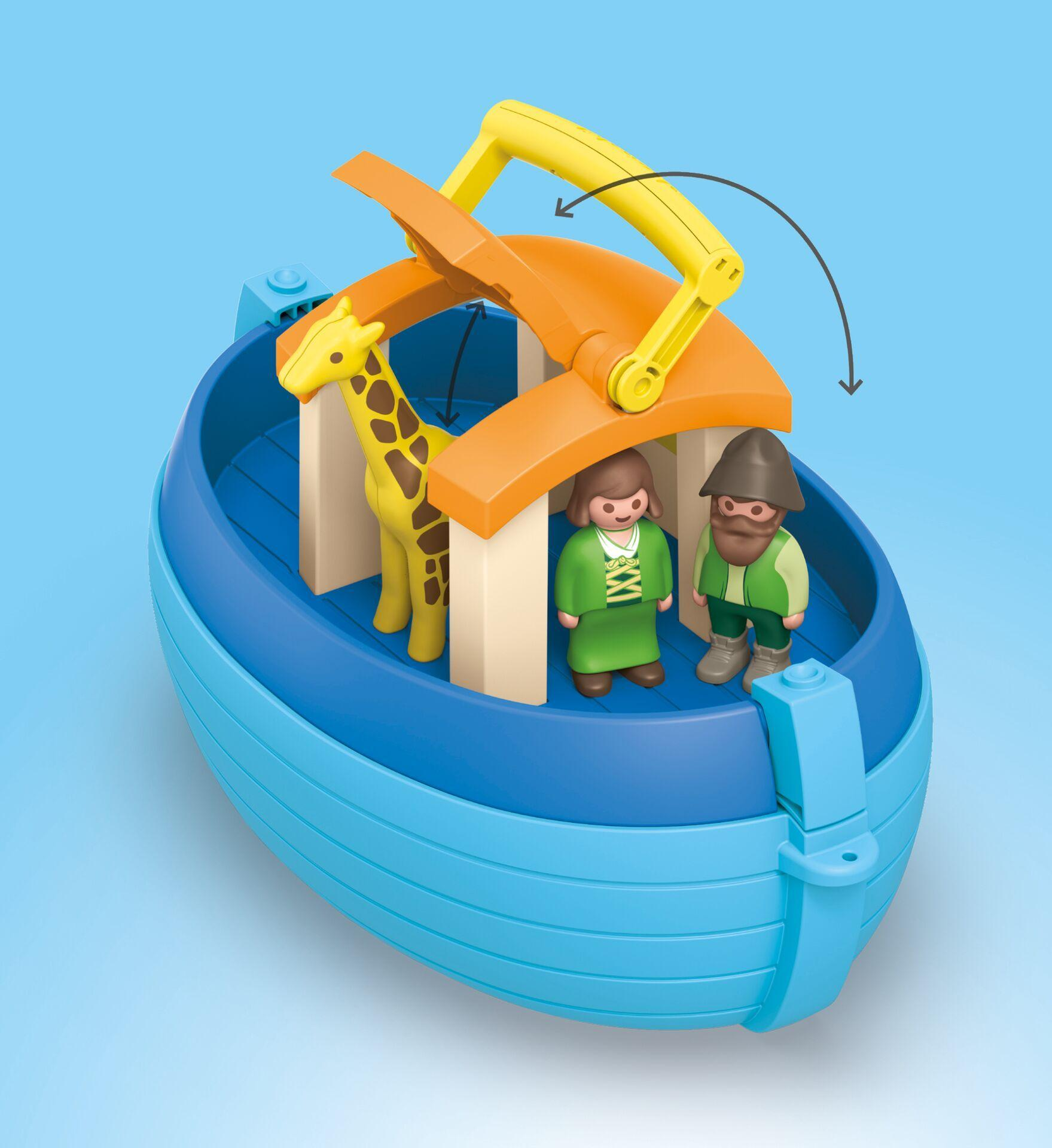 A blue toy boat with a giraffe and two figures under a yellow-orange roof against a light blue background.