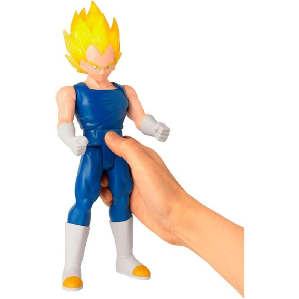 Ręka trzyma figurkę akcji Super Saiyan Vegety z żółtymi włosami i w niebieskim stroju.
