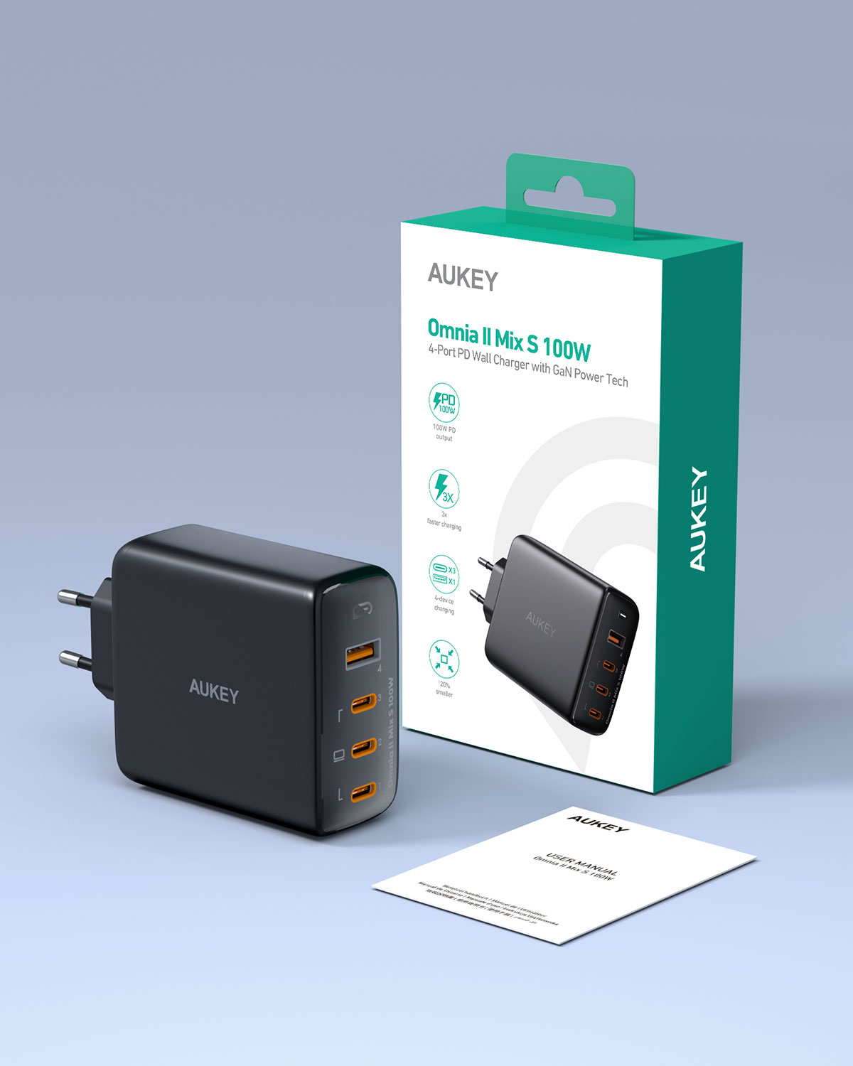 Gri zemin üzerinde ambalajı ve kılavuzuyla siyah bir Aukey Omnia II Mix S 100W şarj cihazı.