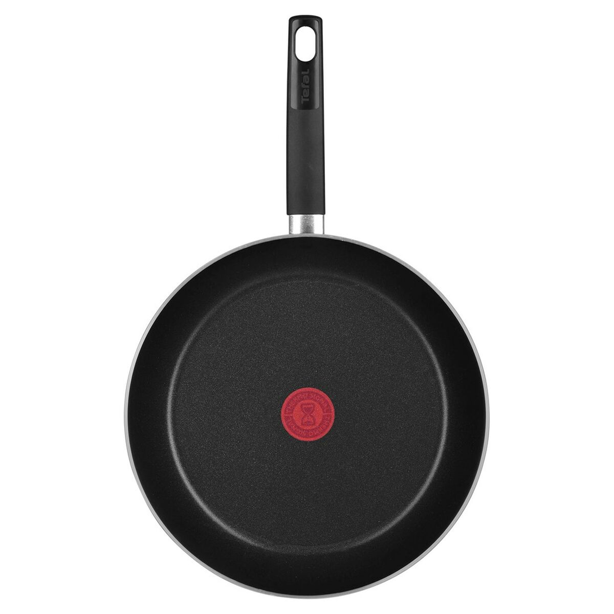 Czarna patelnia Tefal z długą rączką i czerwonym wskaźnikiem ciepła w środku na białym tle.