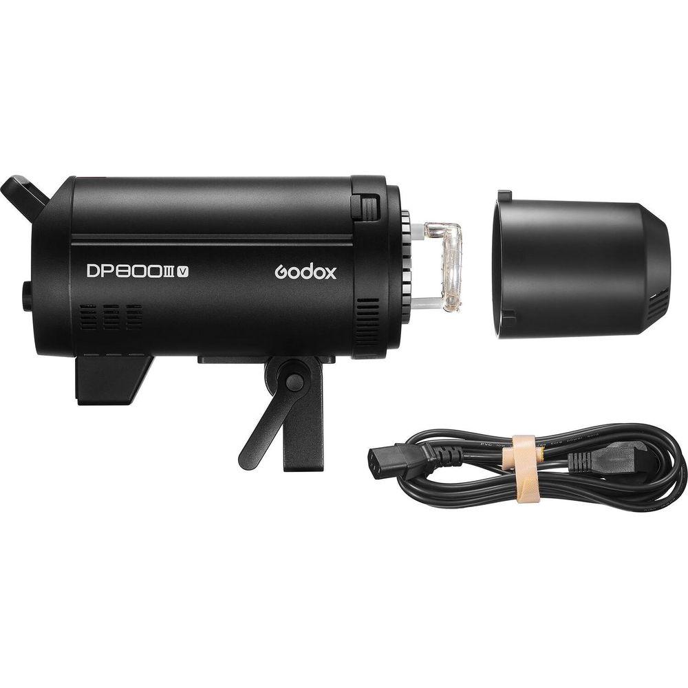 Czarna lampa błyskowa studyjna Godox DP800III-V ze zdjetą osłoną i zwiniętym kablem zasilającym obok.