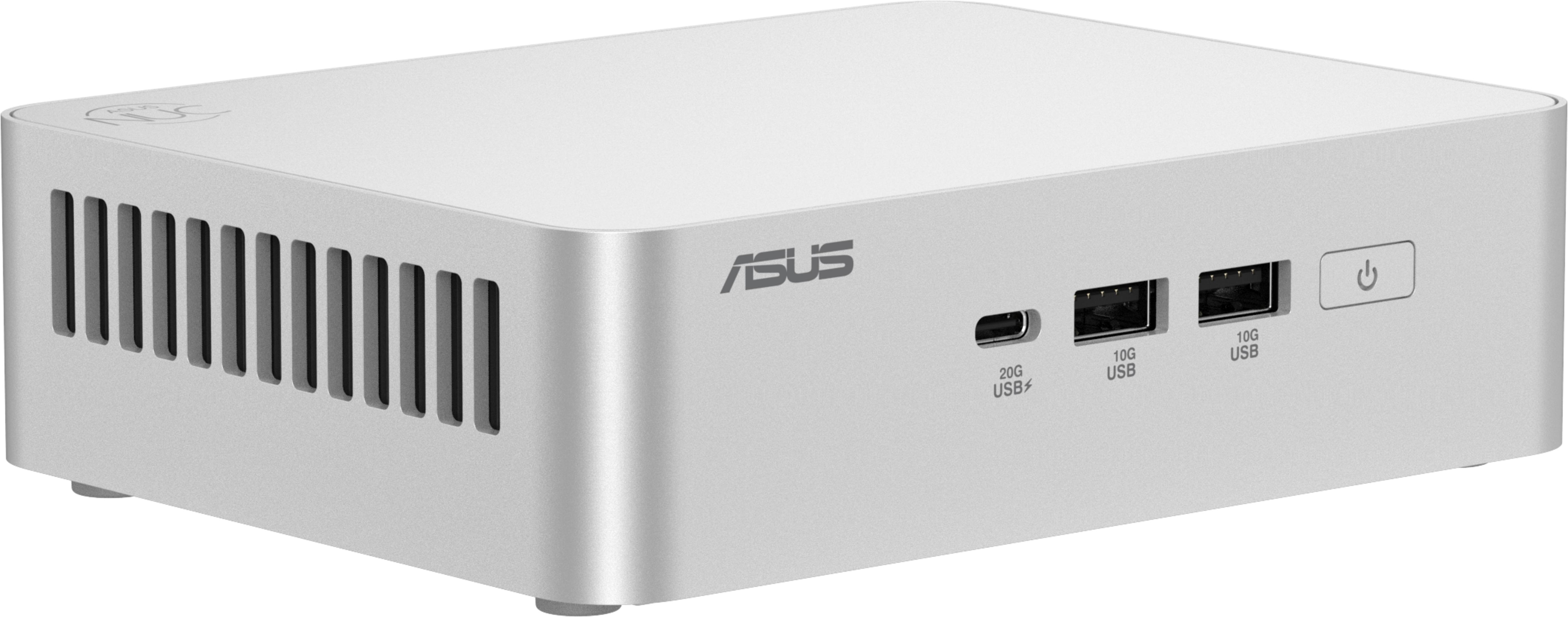 Mini PC ASUS argento con porte USB, pulsante di accensione e feritoie di ventilazione laterali su sfondo bianco.