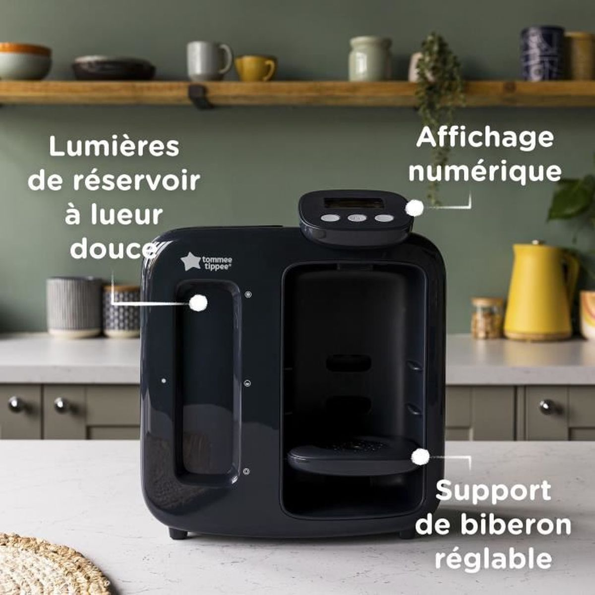 Eine schwarze Tommee Tippee Flaschenzubereitungsmaschine auf einer Küchenarbeitsplatte.