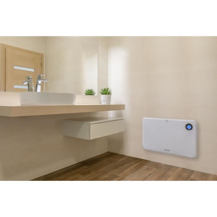 Modernes Badezimmer mit Waschbecken, Spiegel und weißem Wandheizkörper an gefliester Wand über Holzboden.