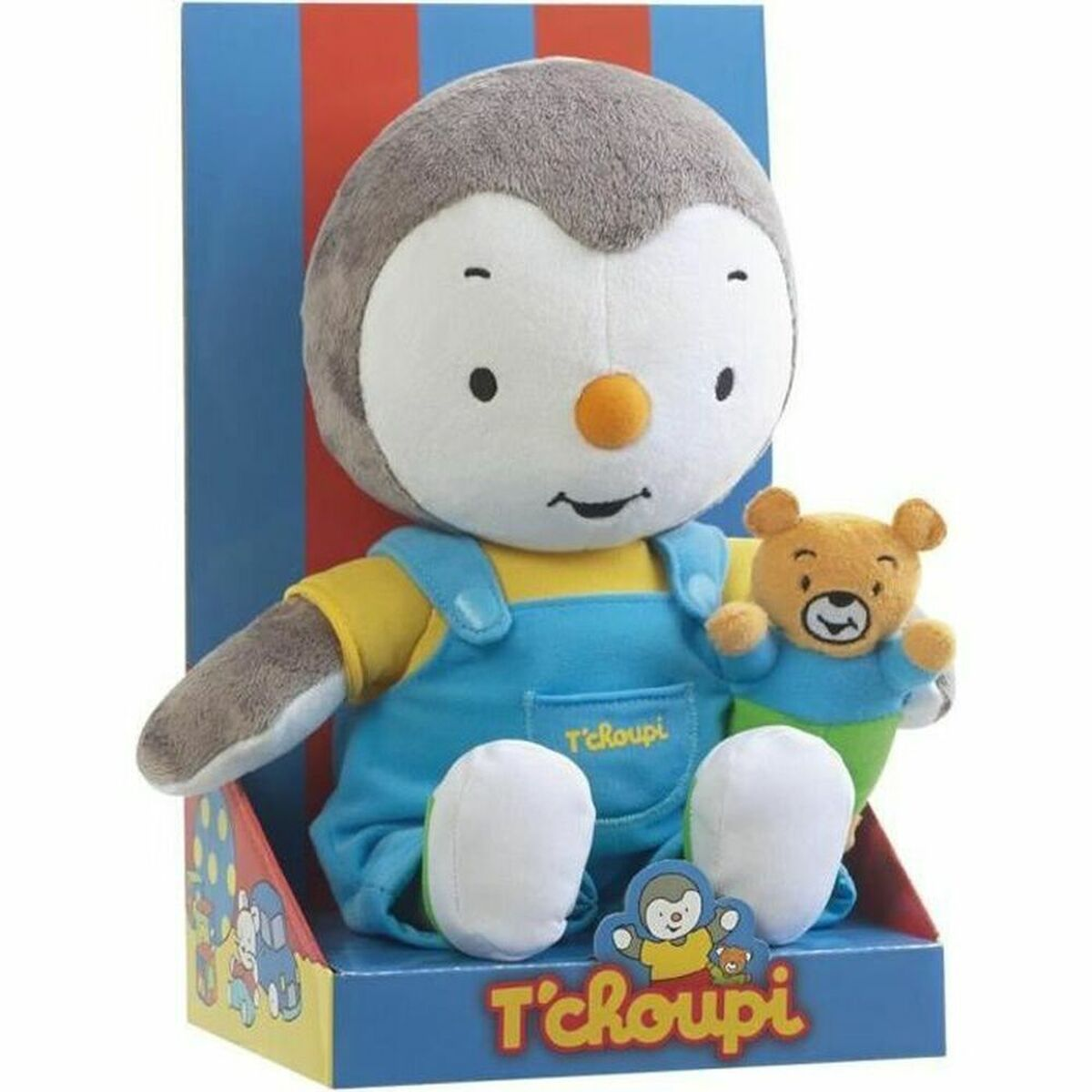 Plüschfigur T'choupi mit blauem Overall, gelbem Shirt und kleinem Bären in einer rot-blau gestreiften Box.