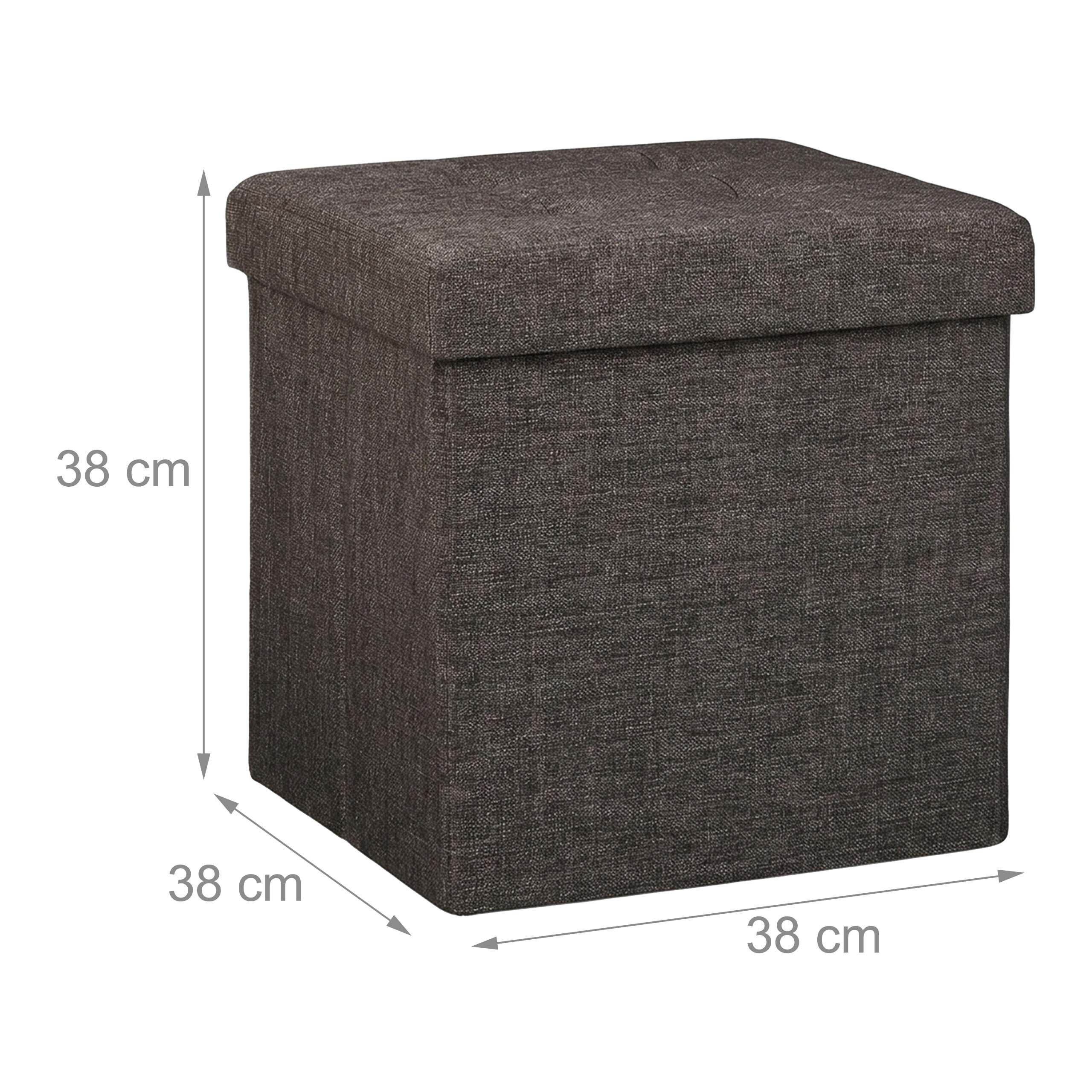 Dunkelgrauer Stoffhocker mit den Maßen 38 x 38 x 38 cm und integrierten Abmessungspfeilen.