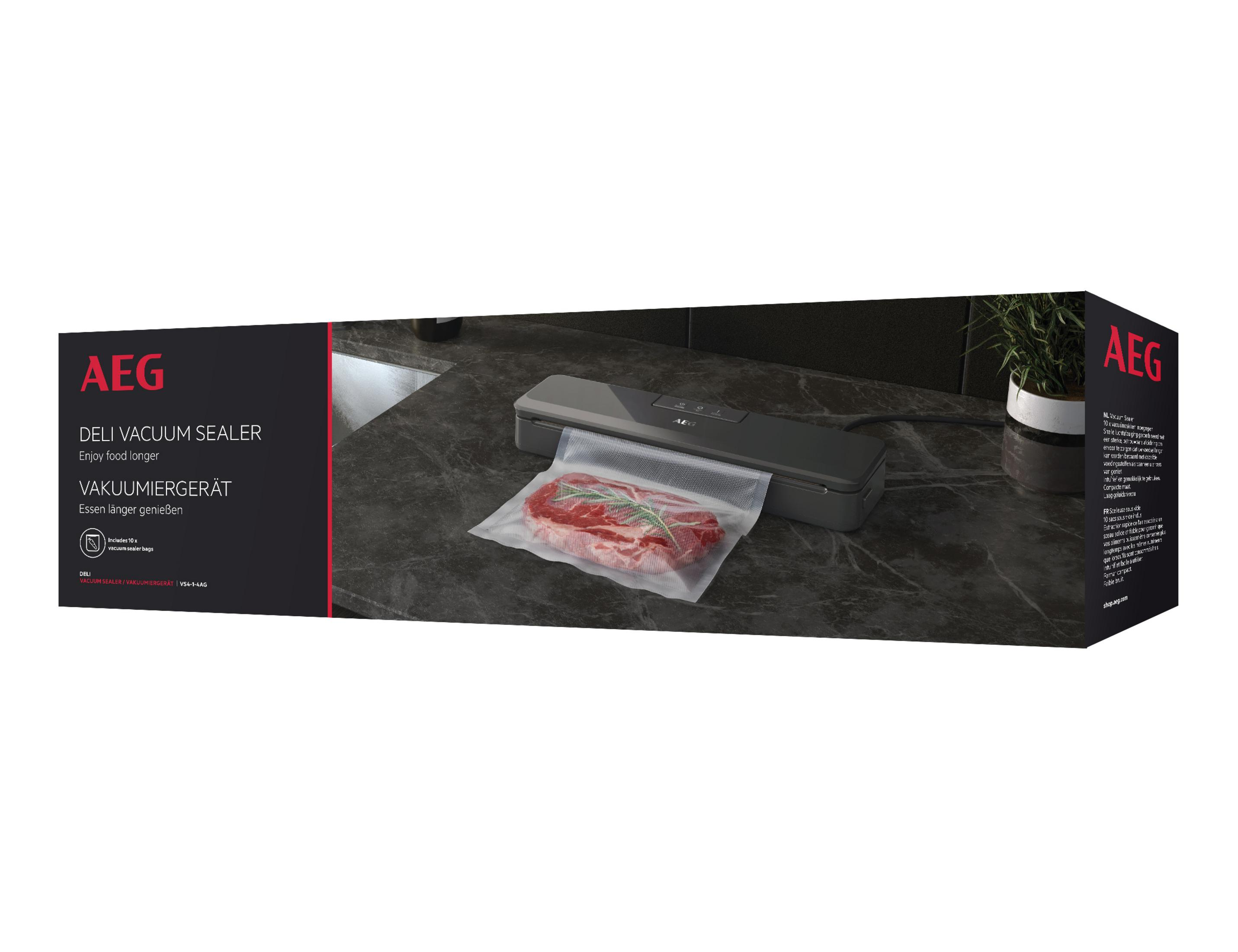 AEG Vakuumiergerät in schwarzer Produktverpackung mit versiegeltem Steak auf dunkler Arbeitsplatte.
