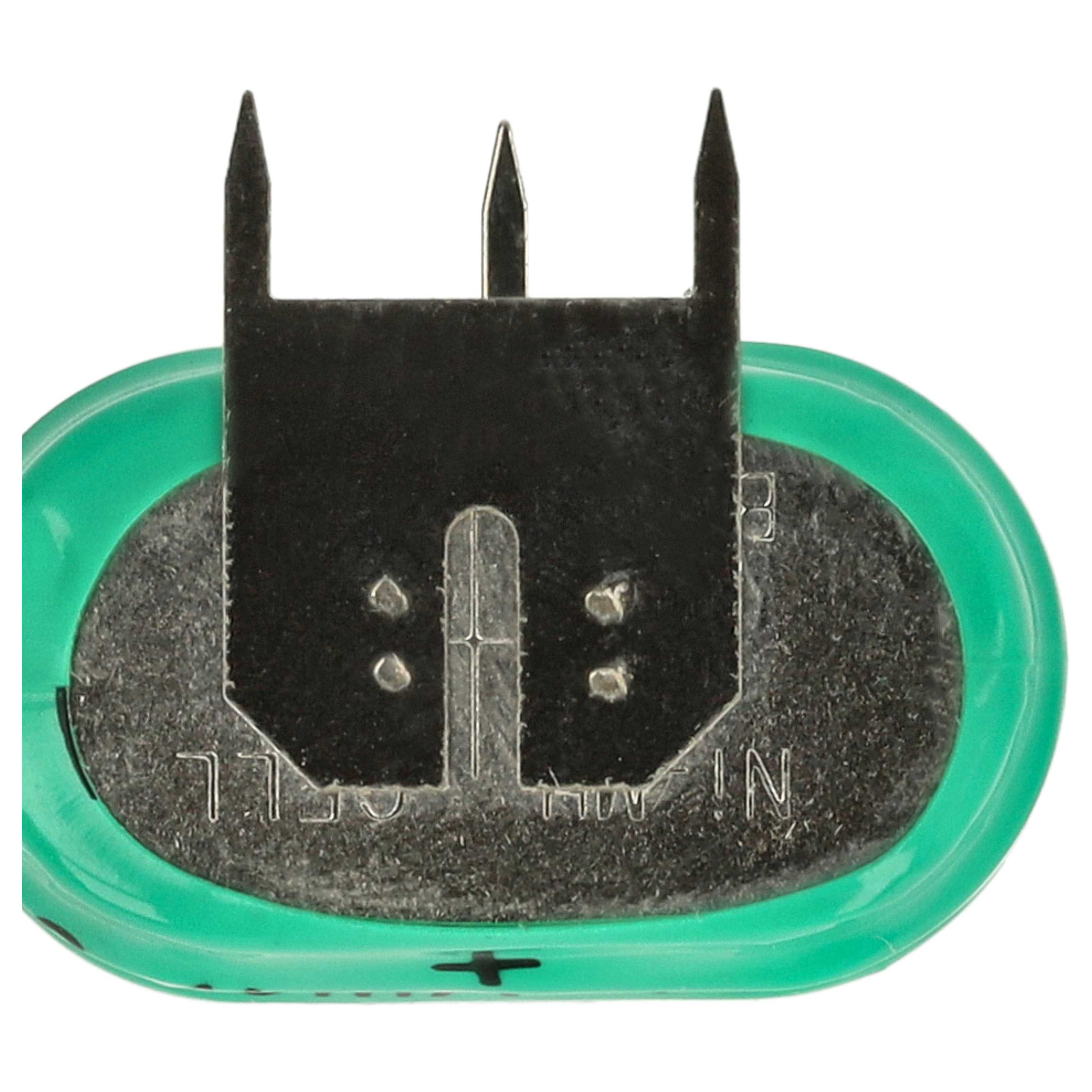 Eine grüne Batterie mit einem dreizackigen Metallverbinder oben.